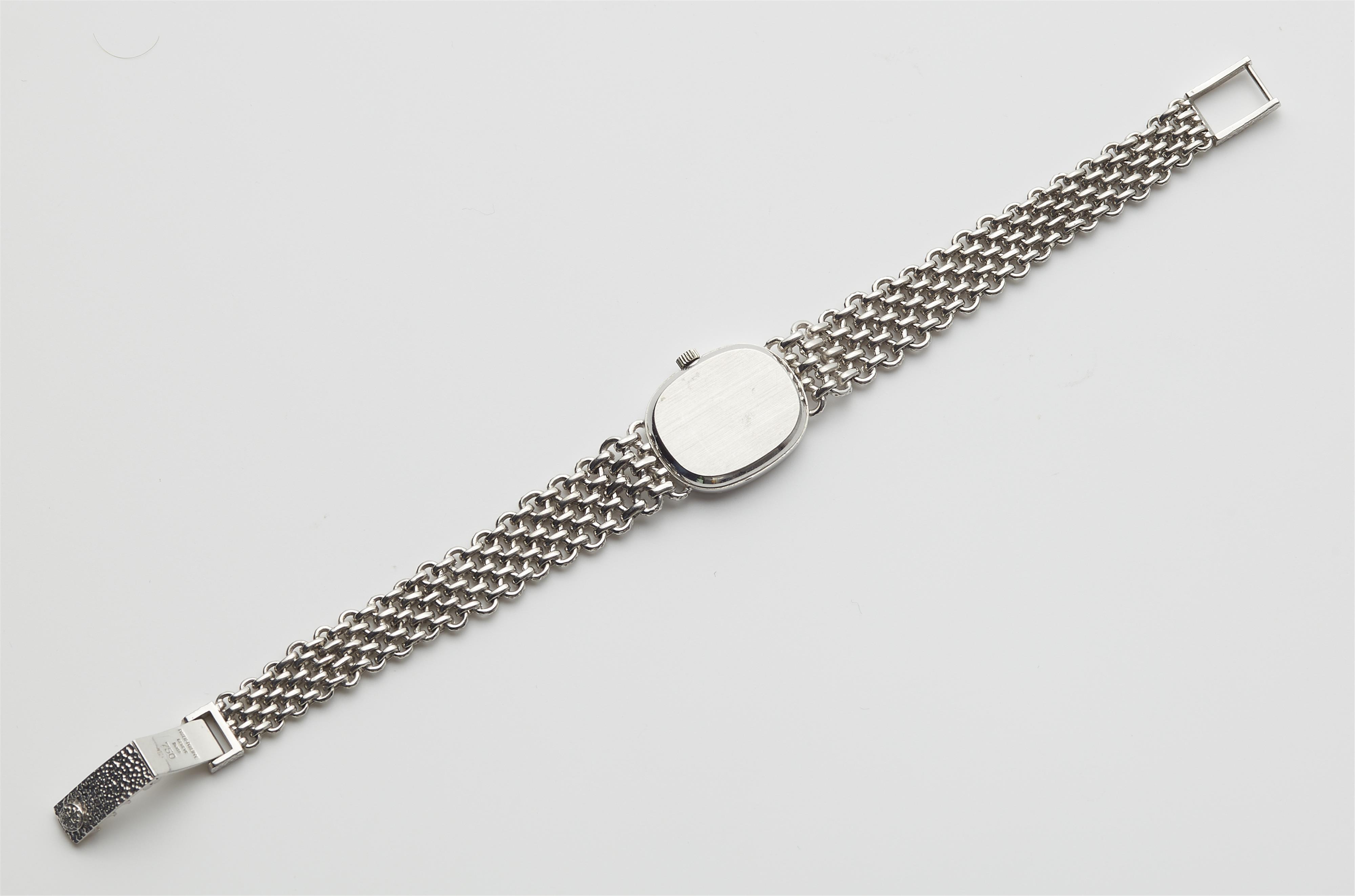 An 18k white gold and diamond manual winding Patek Philippe ladies wristwatch. - image-3