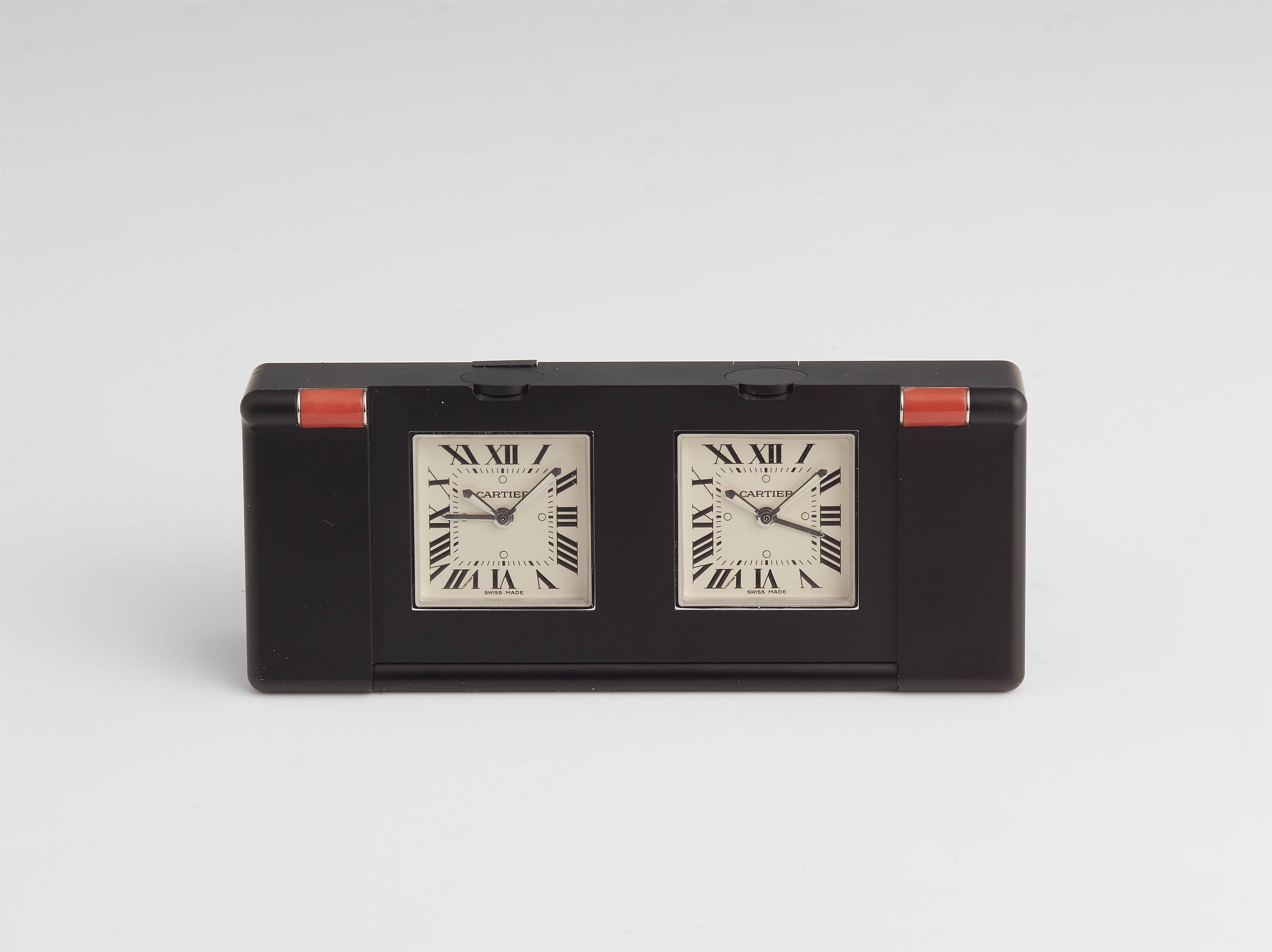 A stainless steel and coral Cartier two time zone travel alarm clock. - image-1