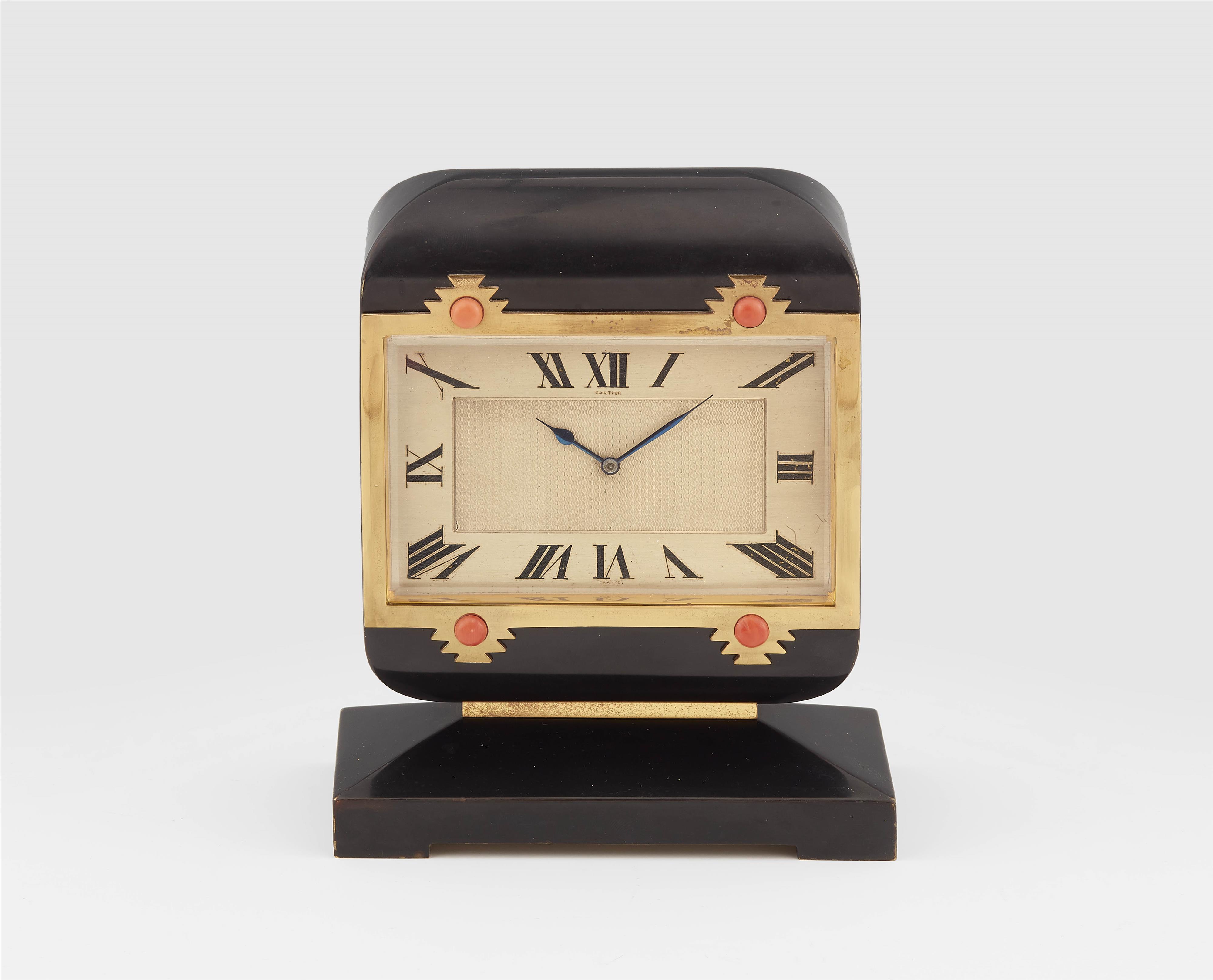 A Cartier gilded metal, lacquer and coral table clock. - image-1