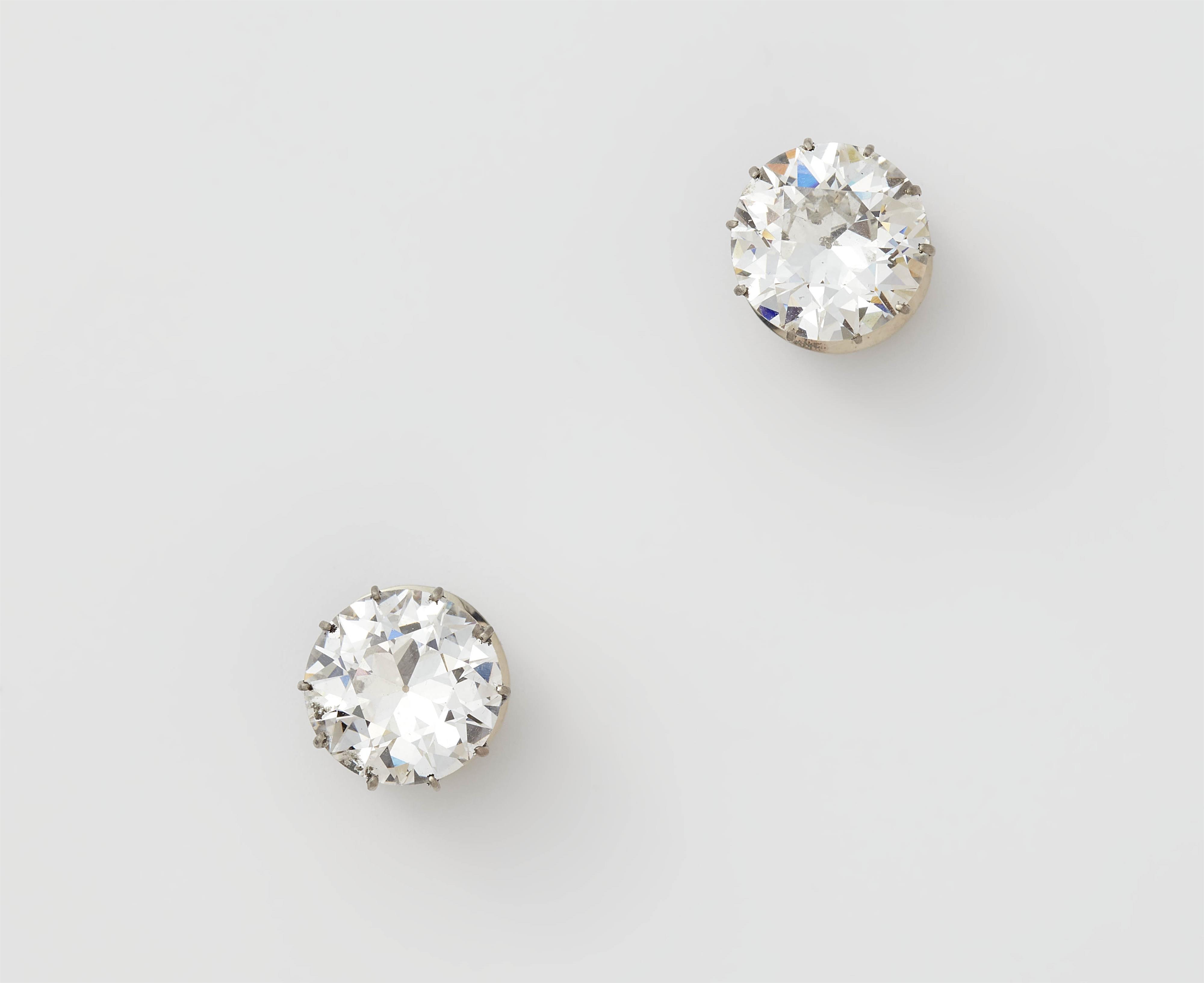 A pair of 14k gold and transition-cut diamond solitaire stud earrings. - image-2