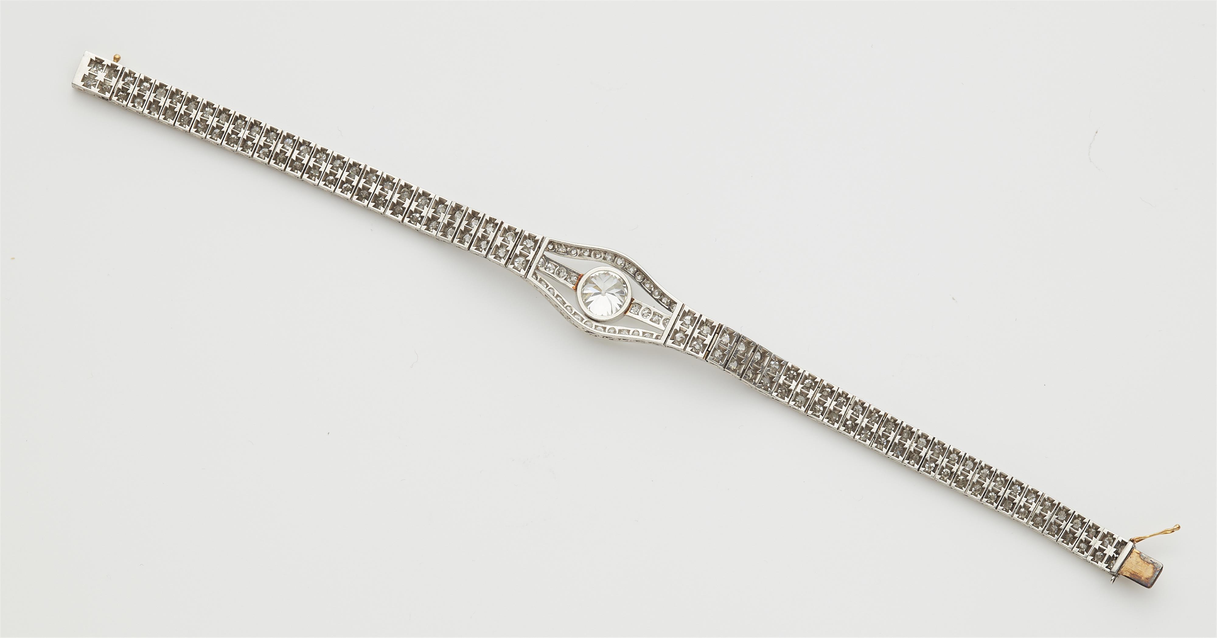 An Art Deco platinum and diamond bracelet with a transition-cut diamond solitaire of ca. 2.15 ct. - image-3