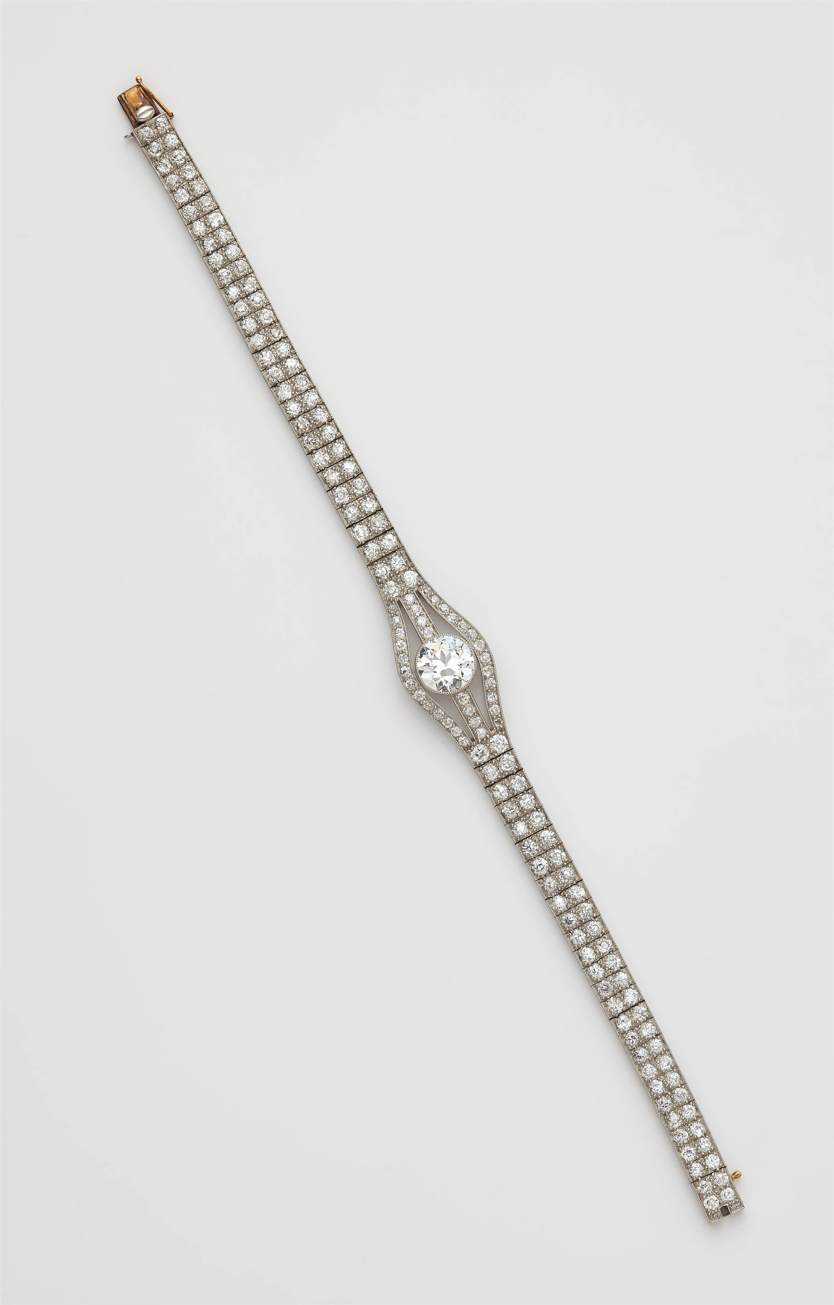 An Art Deco platinum and diamond bracelet with a transition-cut diamond solitaire of ca. 2.15 ct. - image-1