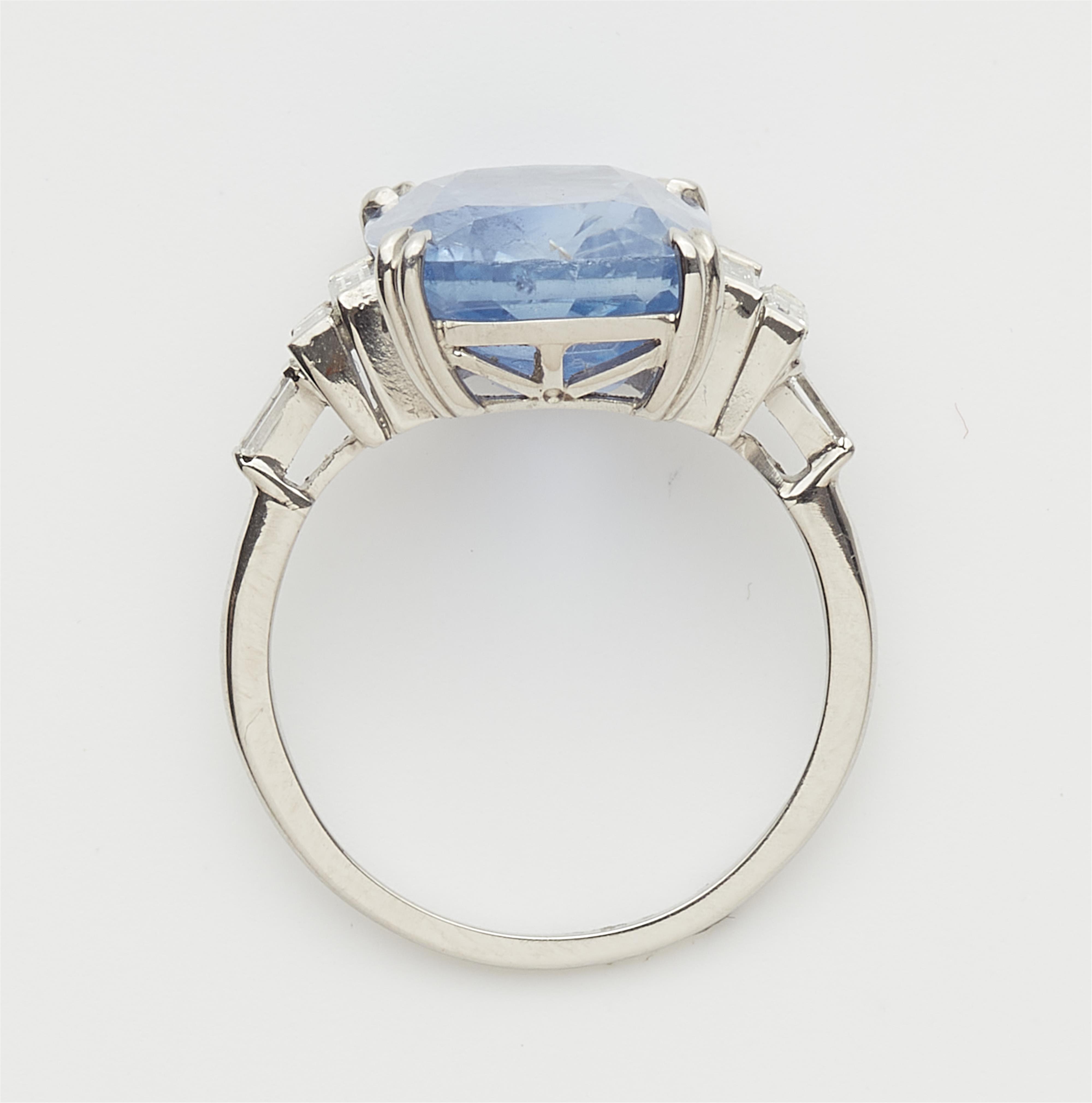 A platinum diamond and natural Ceylon sapphire ring. - image-2