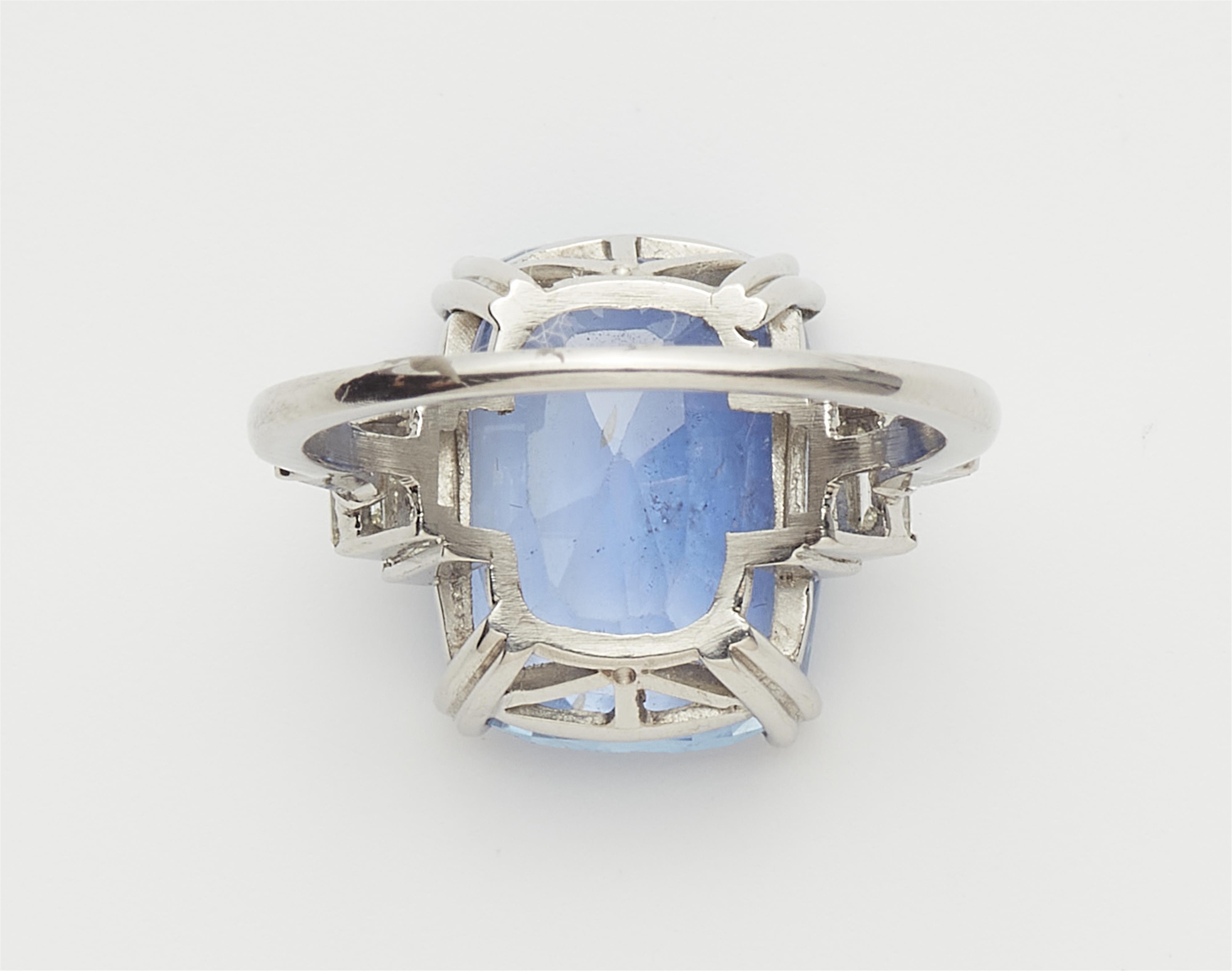 A platinum diamond and natural Ceylon sapphire ring. - image-3