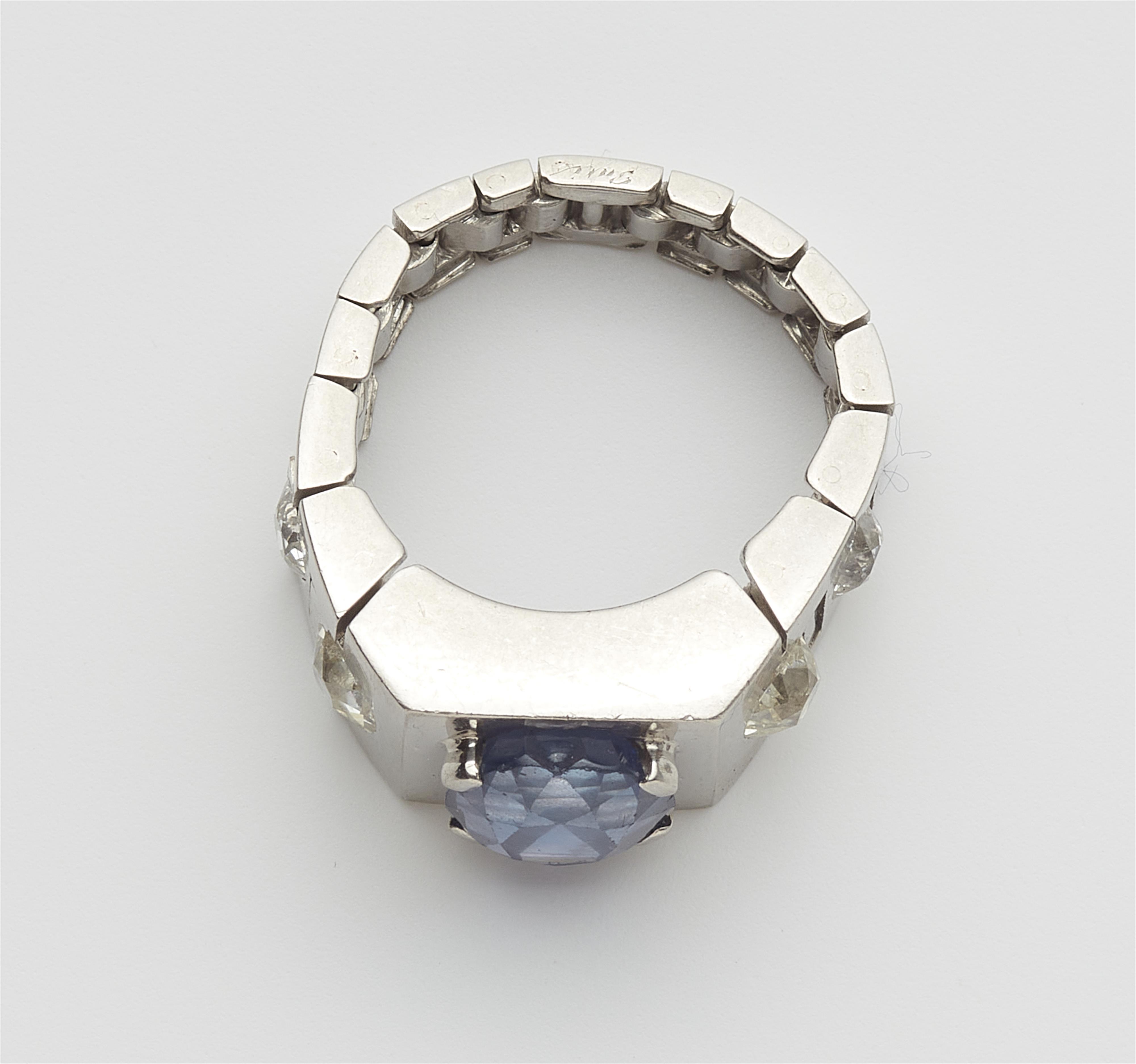 A French Art Deco platinum diamond chain ring with a rare colour change Ceylon sapphire. - image-4