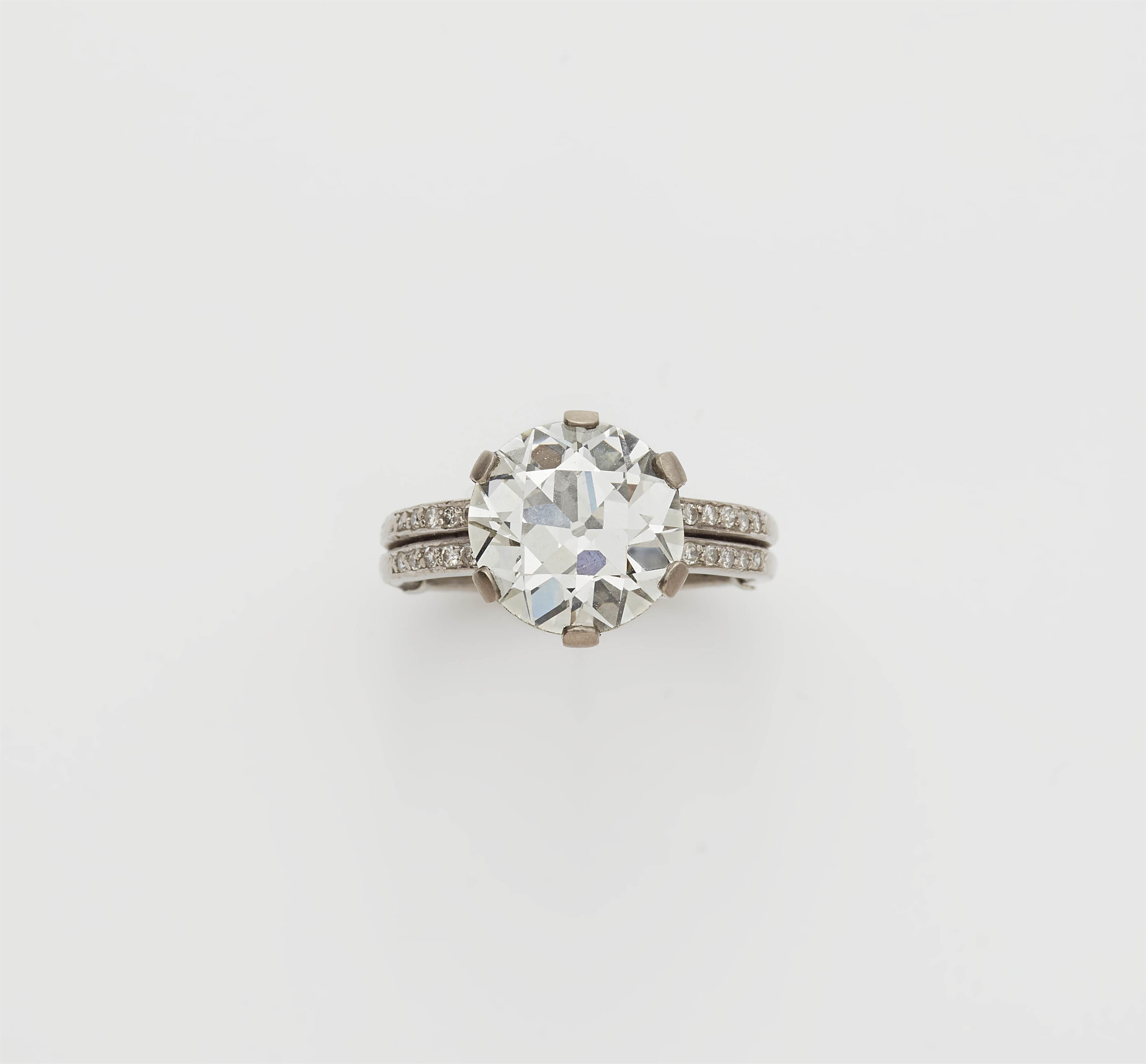 An 18k gold 6.54 ct transition-cut diamond solitaire ring. - image-1