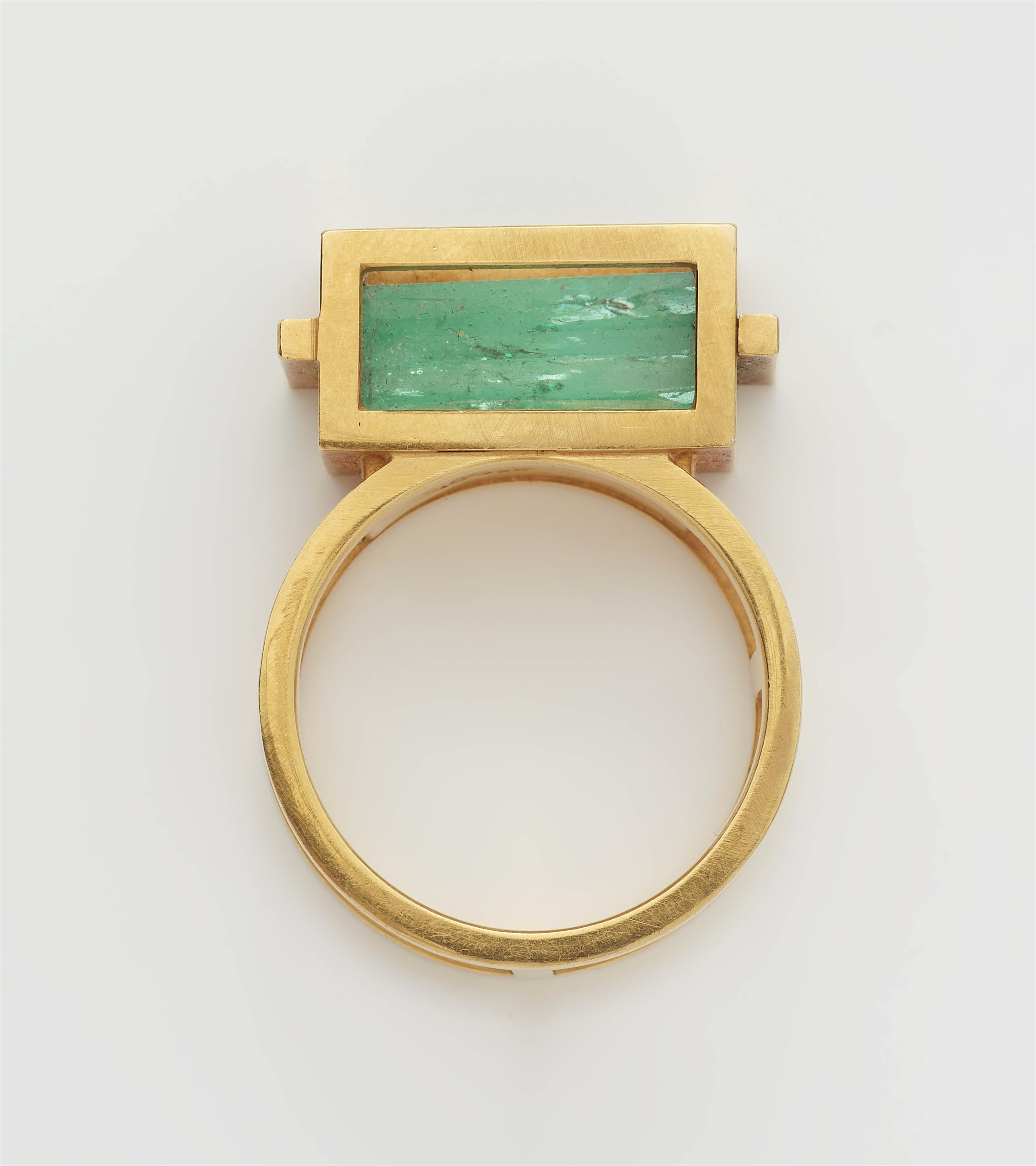 A German 18k gold and emerald prism gentleman's ring. - image-1