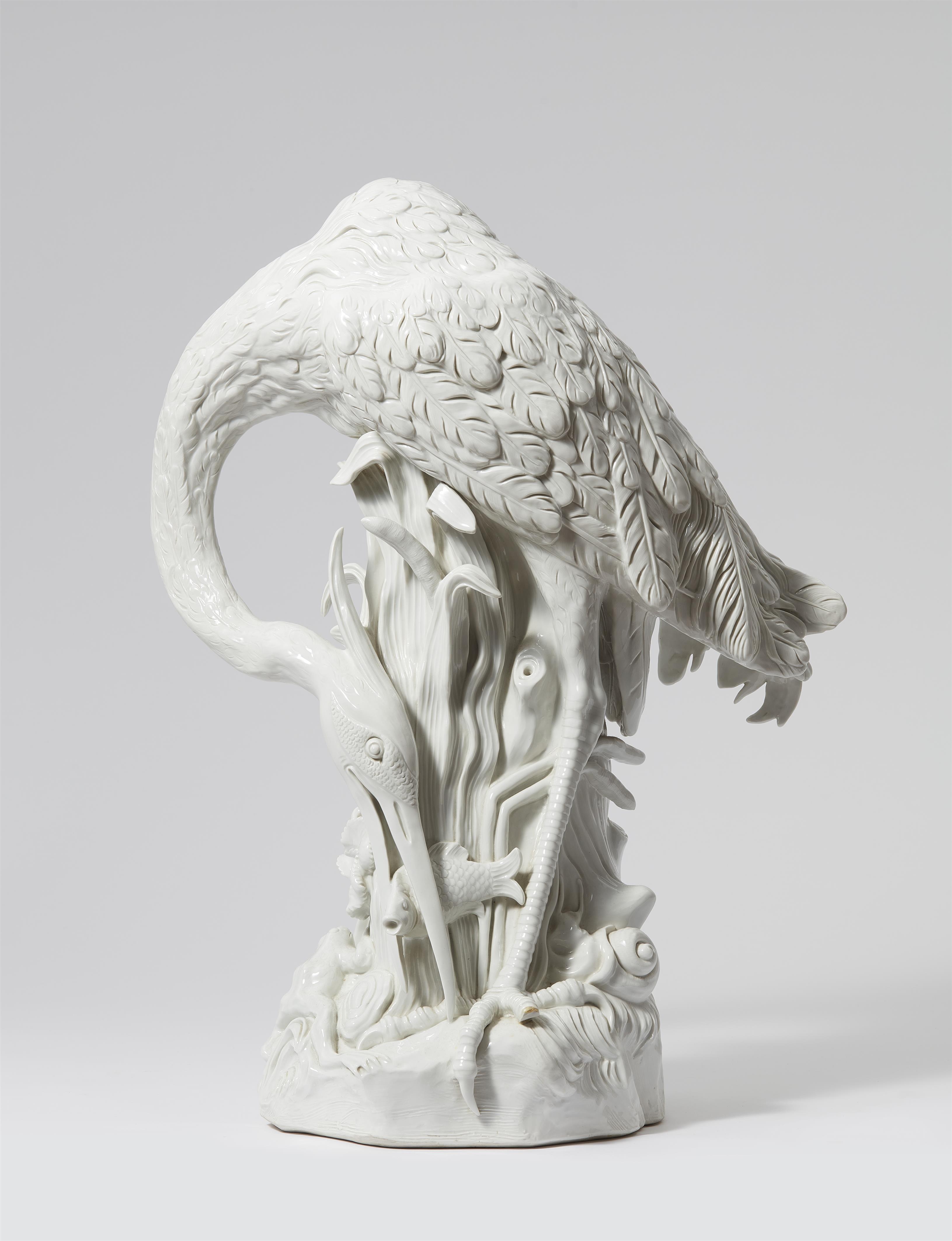 A Meissen white porcelain figure of a heron with a fish - image-1