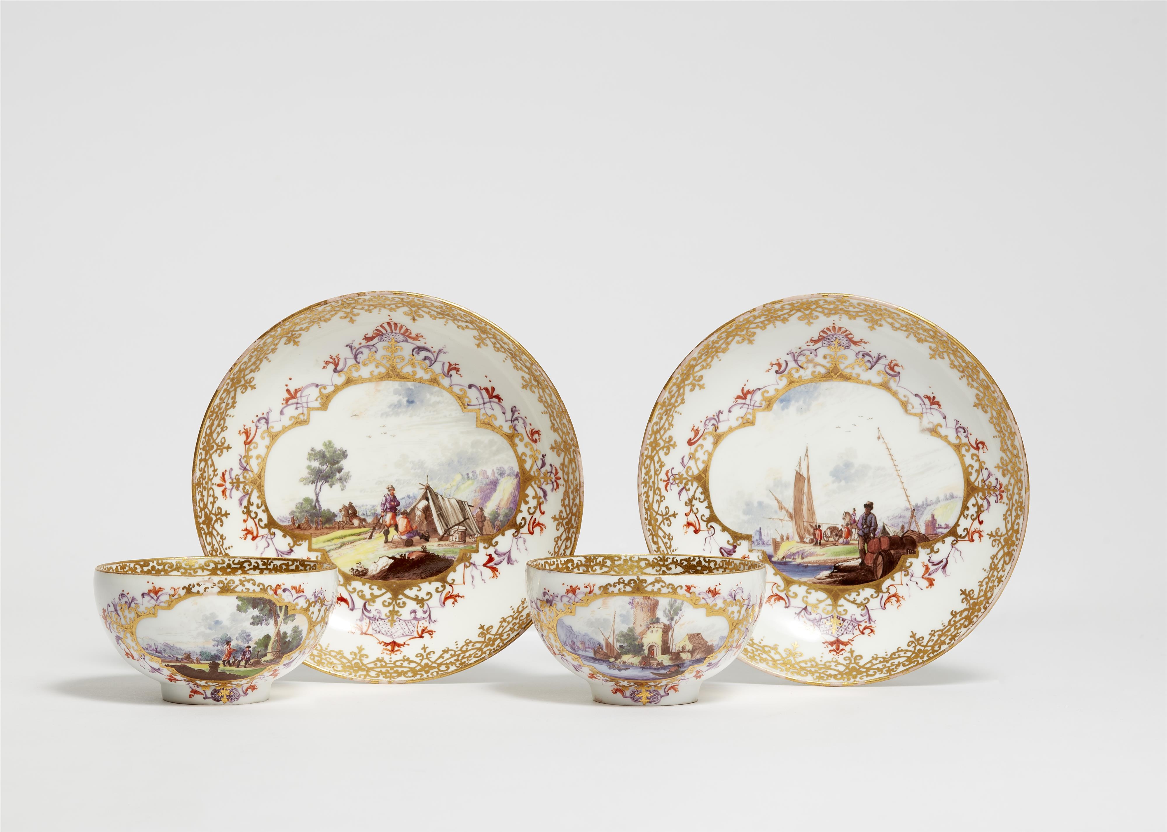 A pair of Meissen porcelain tea bowls and saucers with landscape decor - image-1