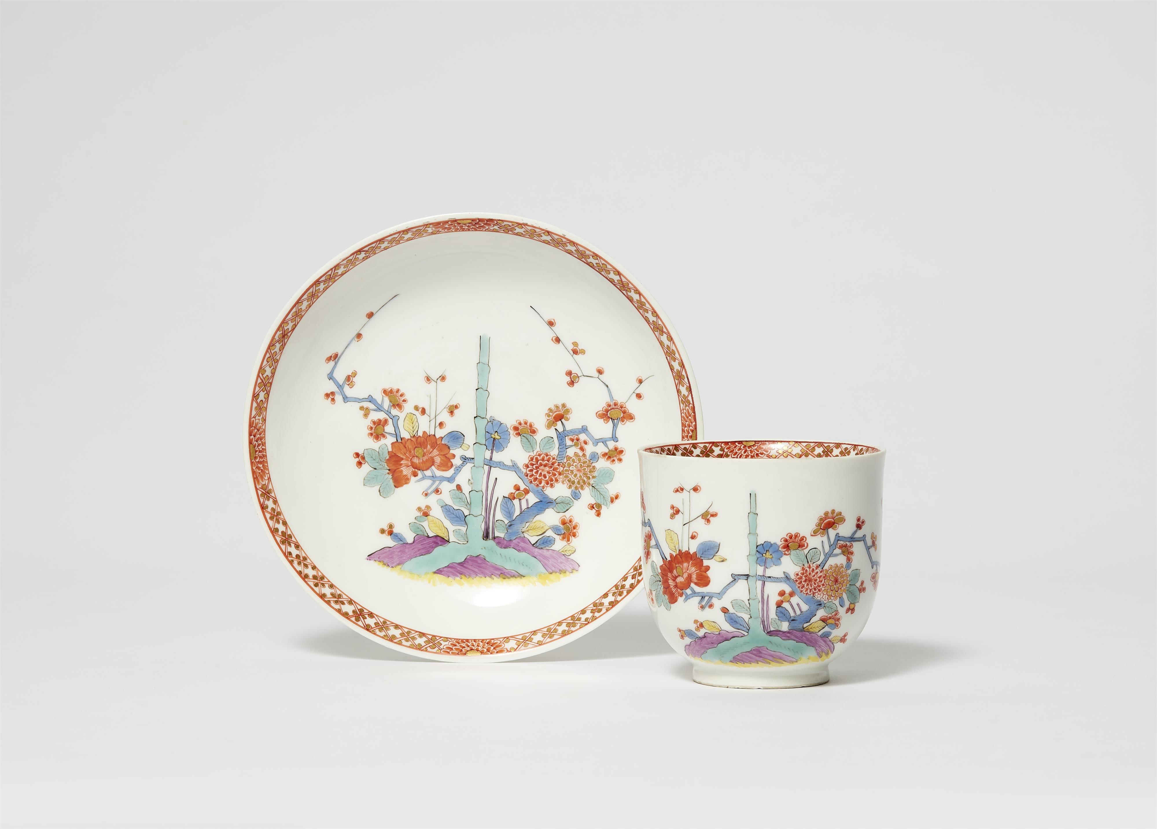 A Meissen porcelain cup and saucer with Chinoiserie bamboo and peony decor - image-1