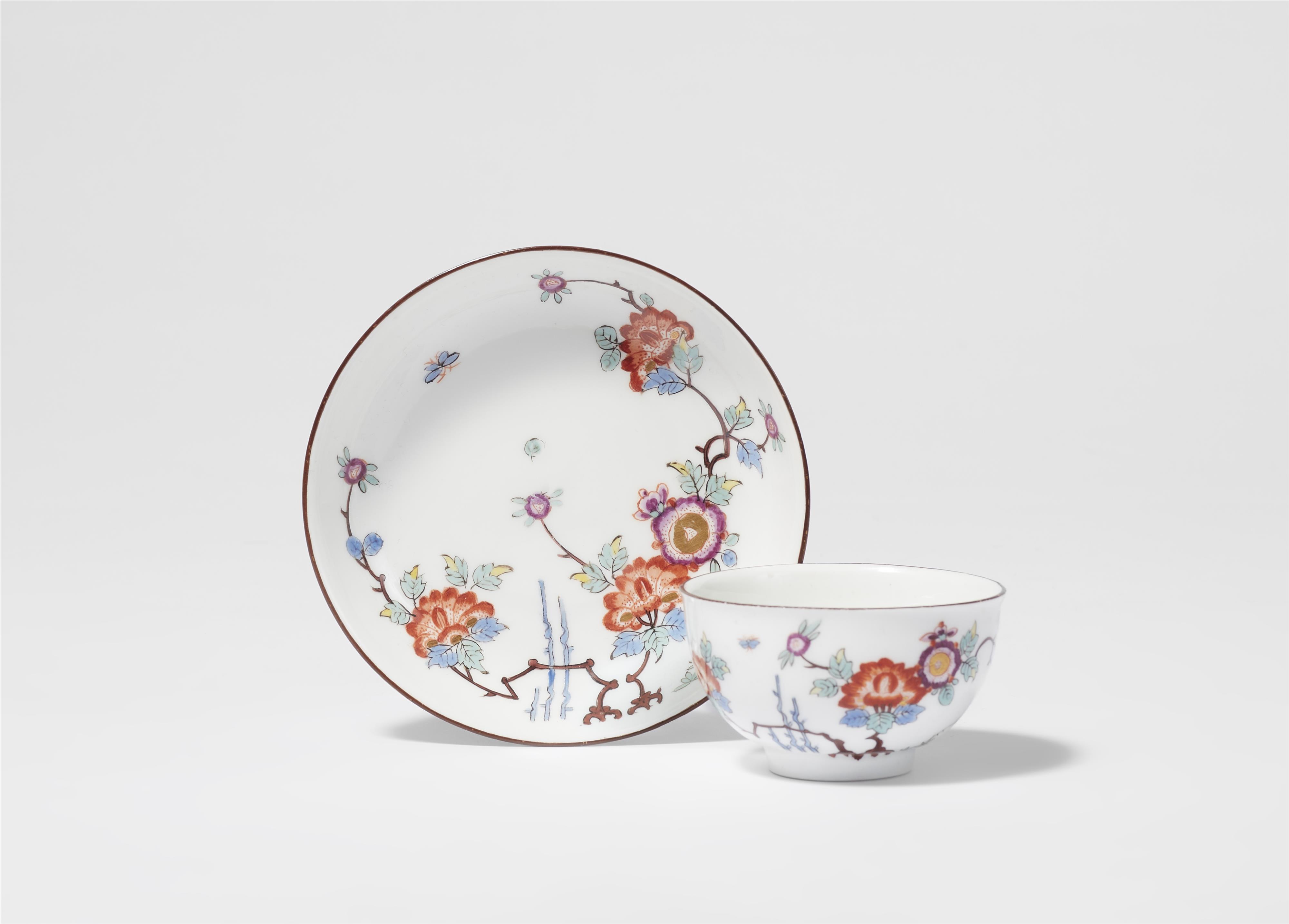 A Meissen porcelain tea bowl and saucer with bamboo and peony decor - image-1