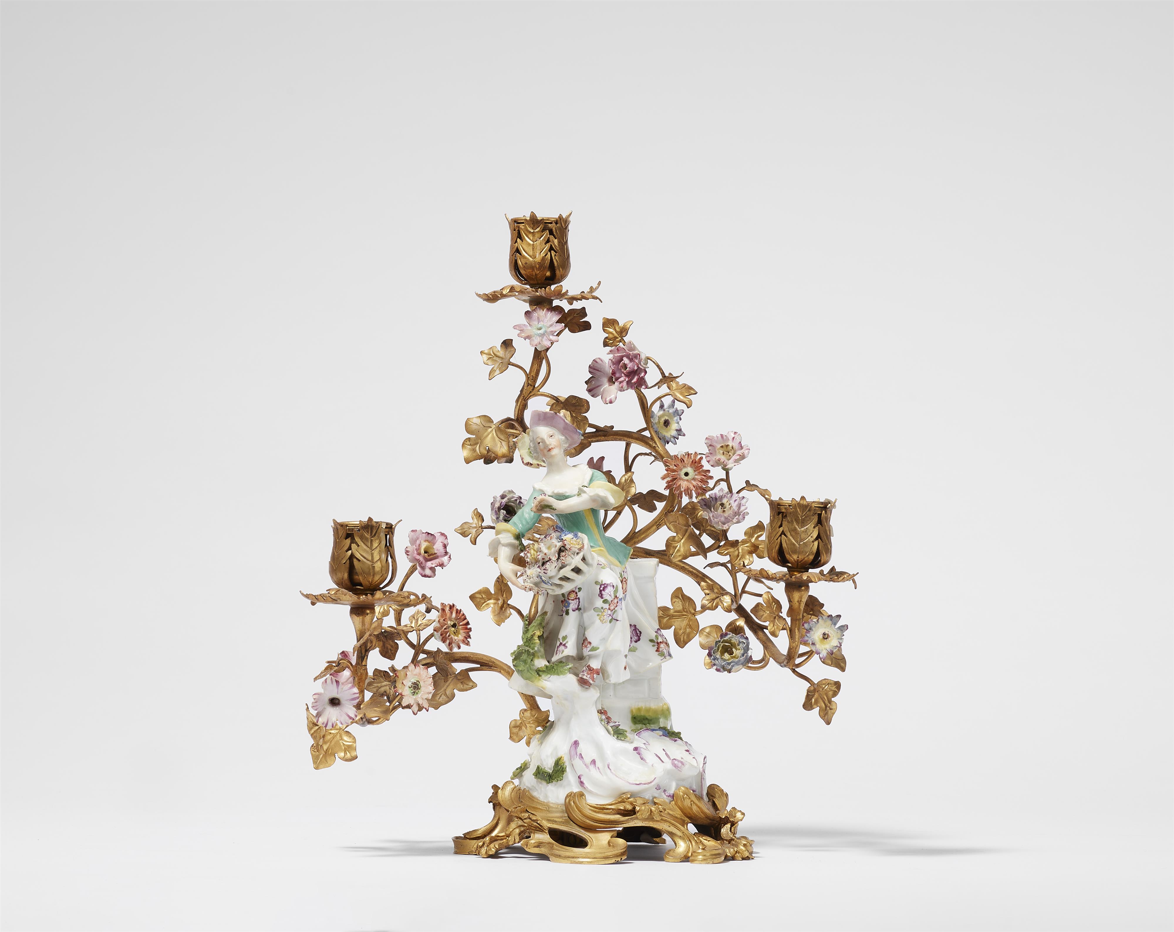 A candelabra with a Meissen porcelain figure of Flora - image-1