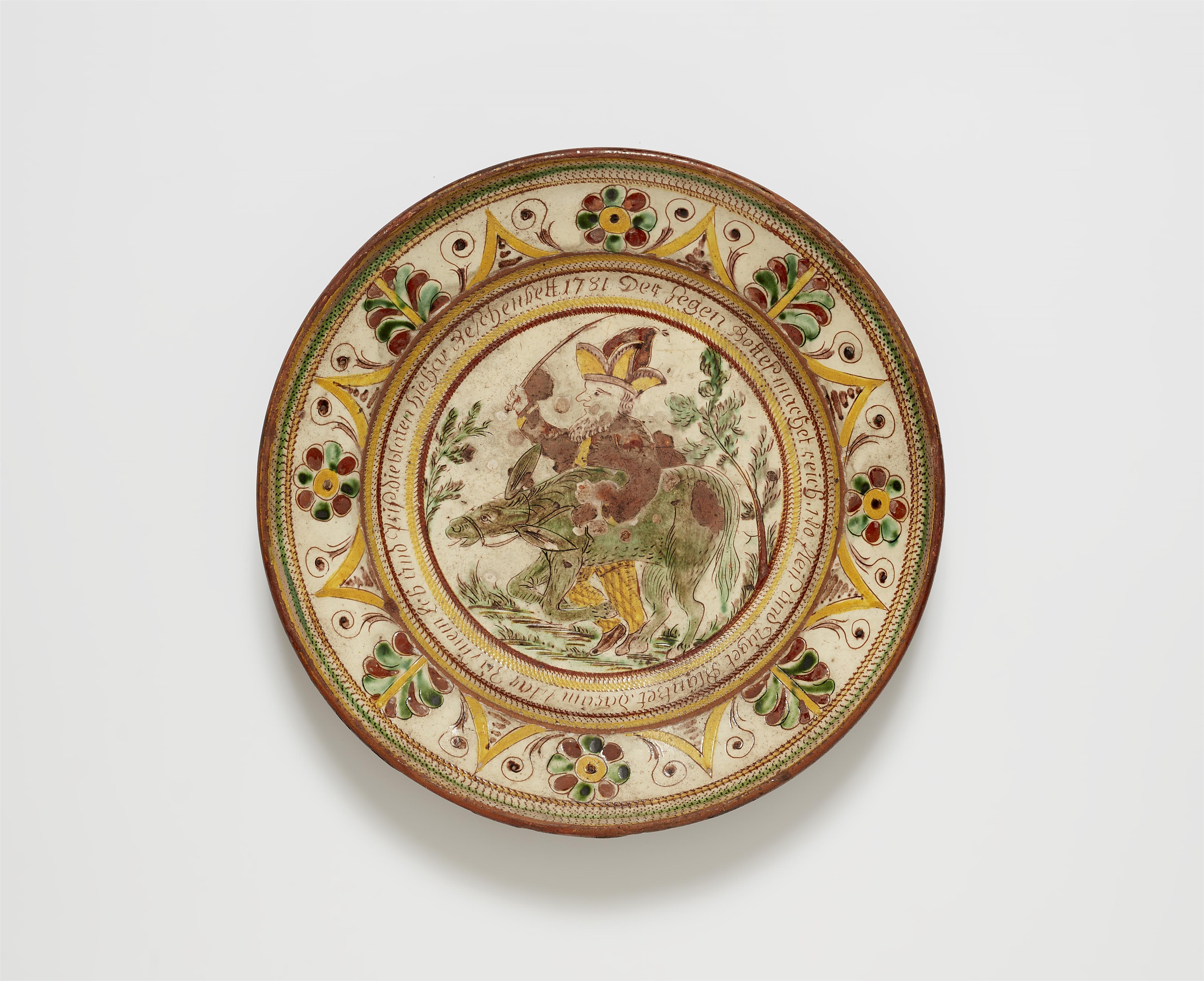 An earthenware plate with a depiction of a fool - image-1