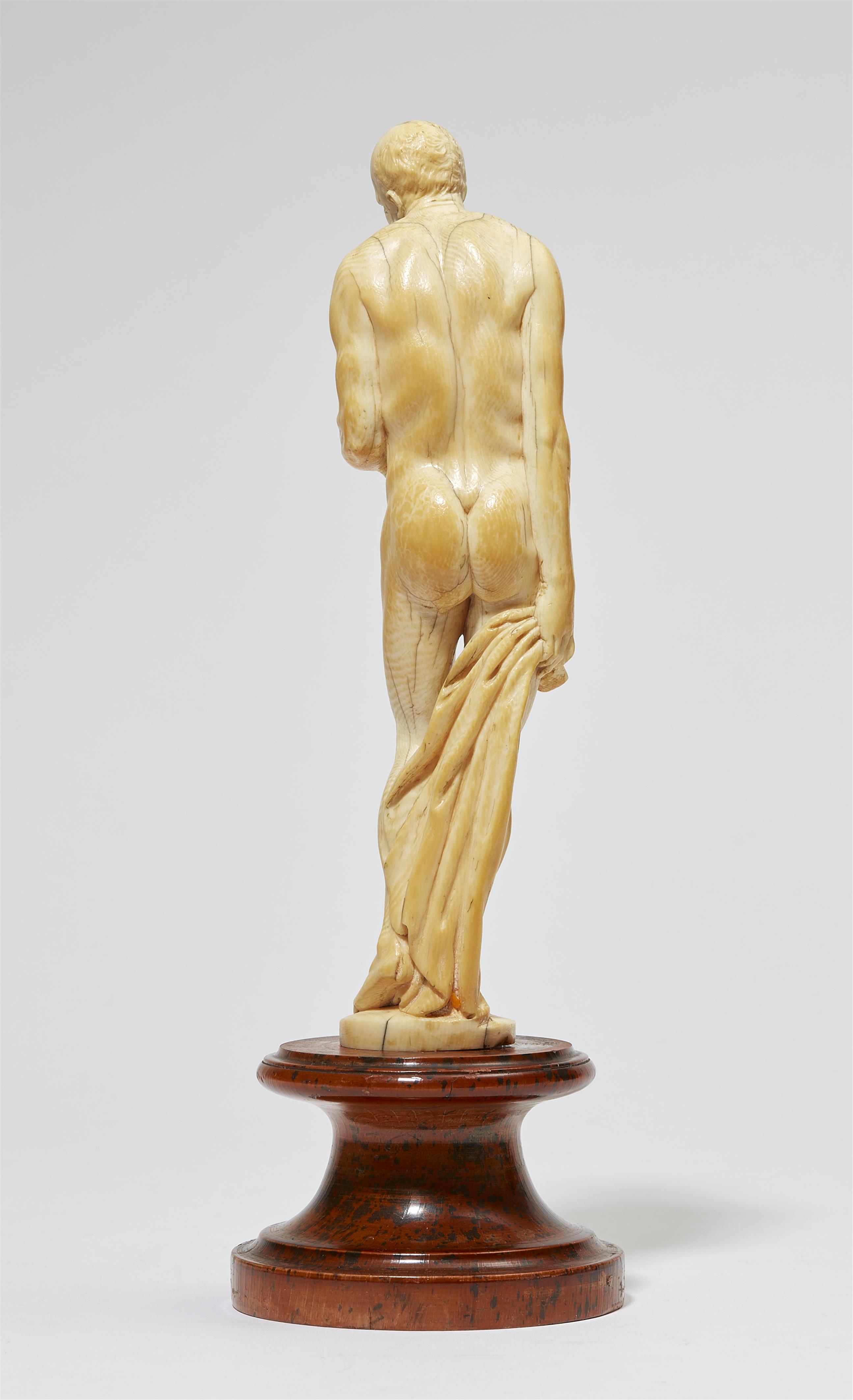 An ivory figure of an old man as Saturn - image-3