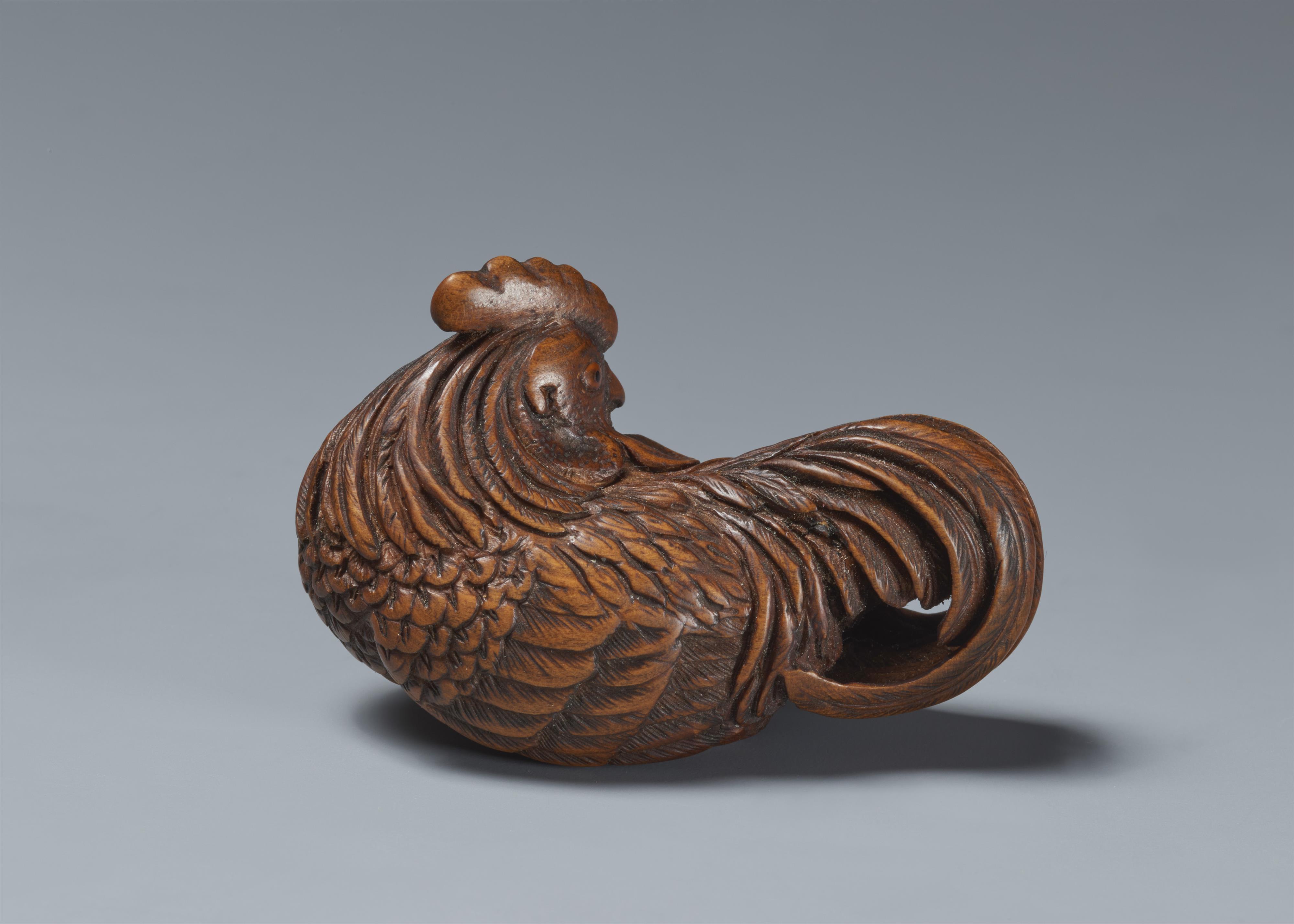 A wood netsuke of a proud rooster. - image-2