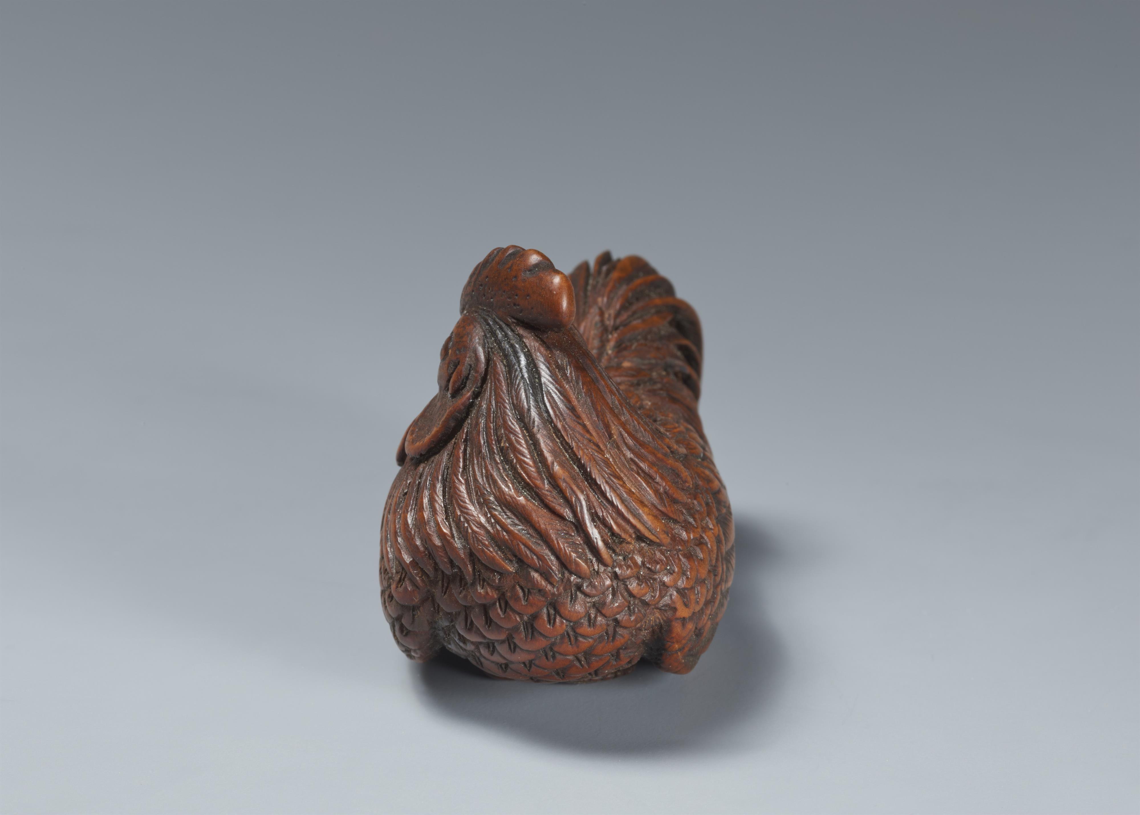 A wood netsuke of a proud rooster. - image-4