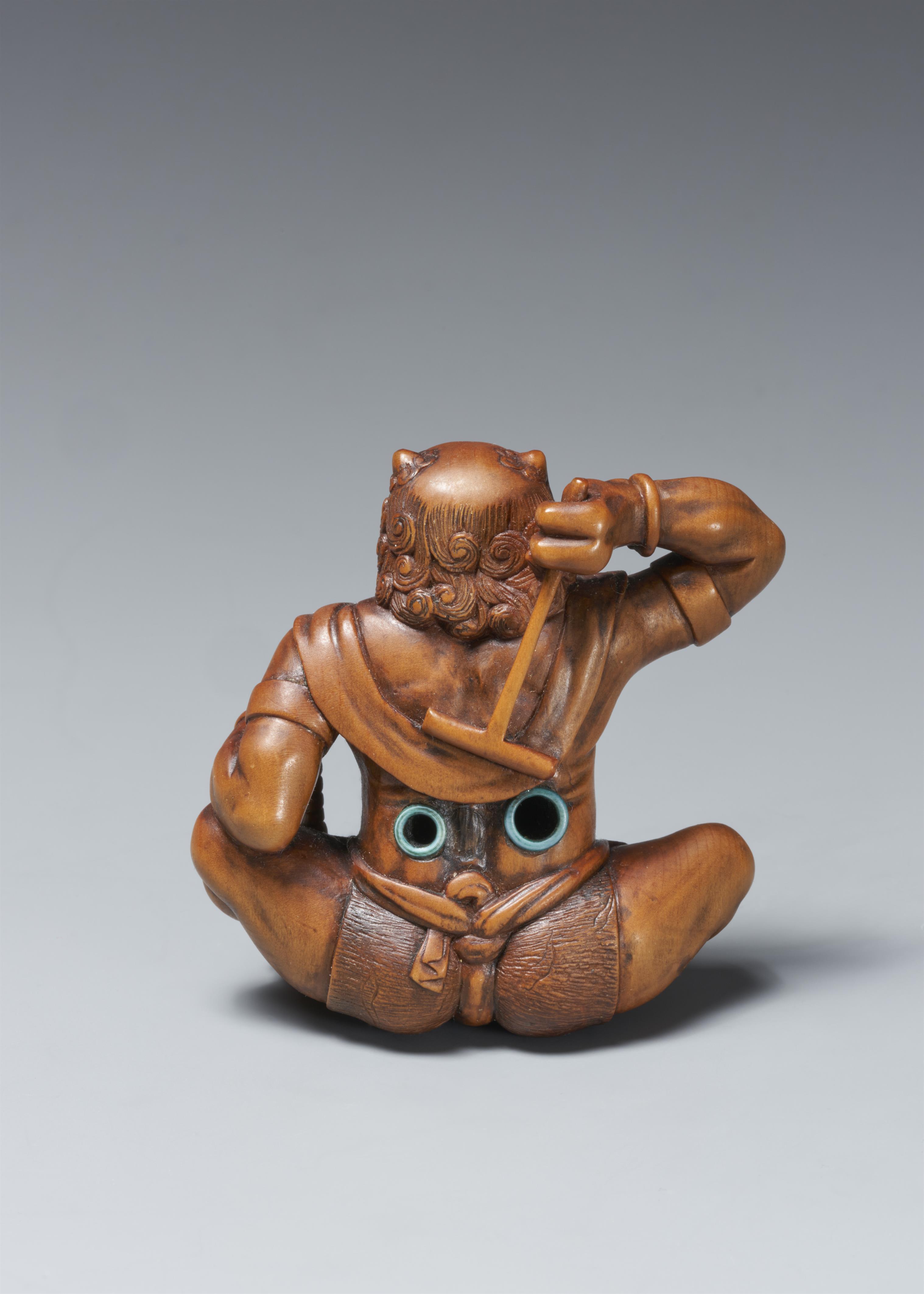 A large boxwood okimono netsuke of a laughing oni. Late 19th century - image-2