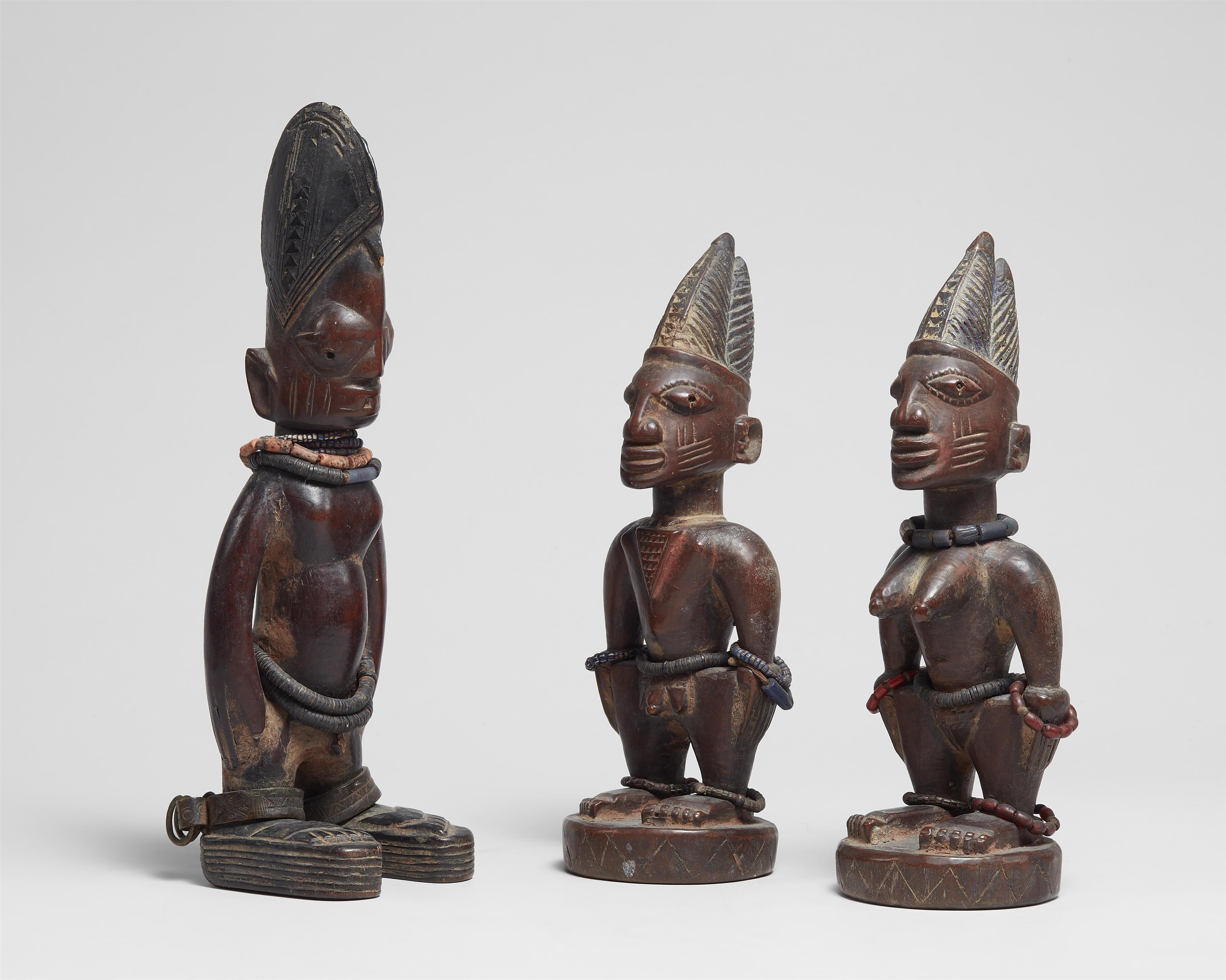 THREE YORUBA TWIN FIGURES 
A male and female pair and a single male - image-1