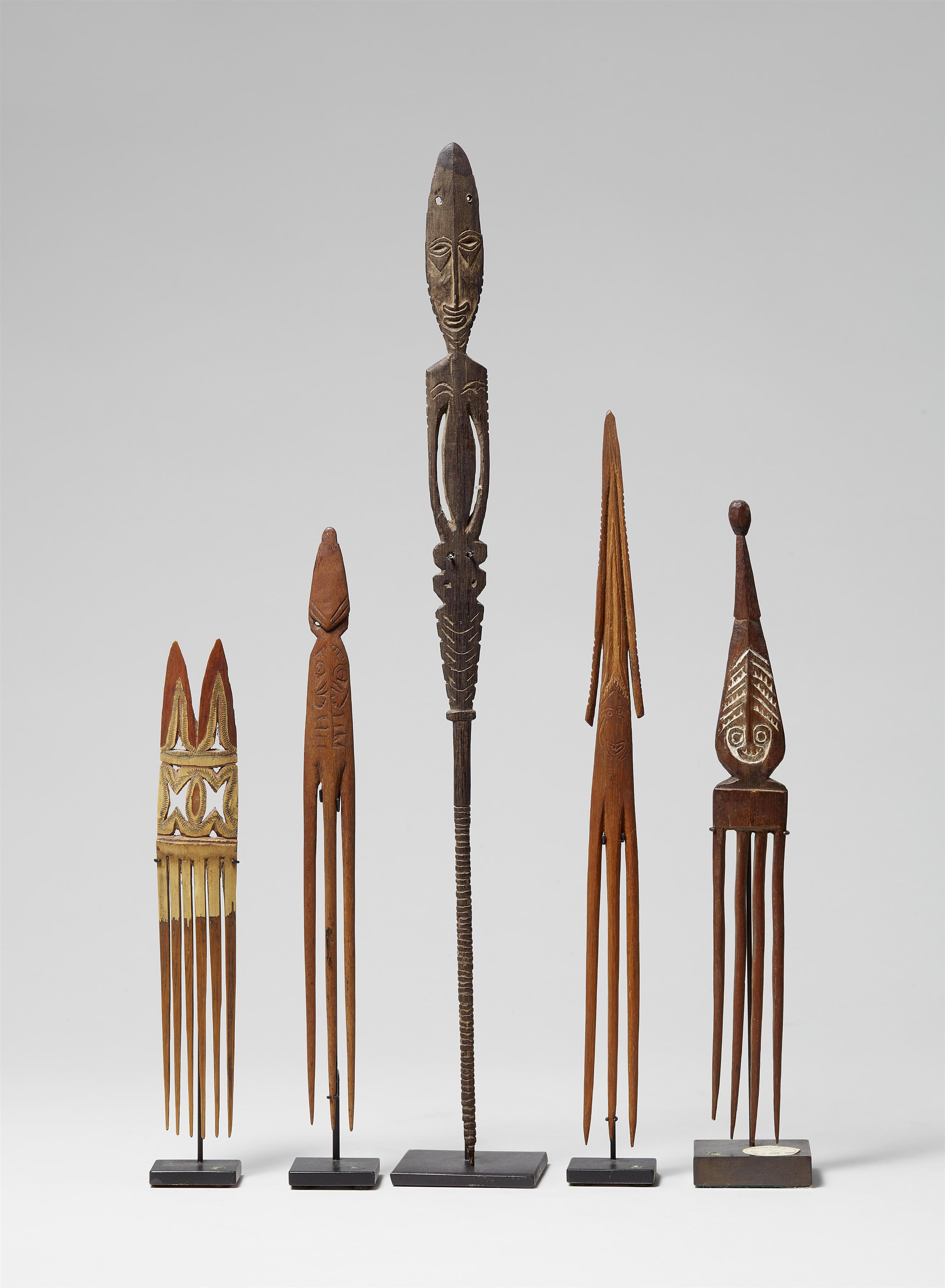 FOUR NEW GUINEA COMBS AND A LIME STICK - image-1