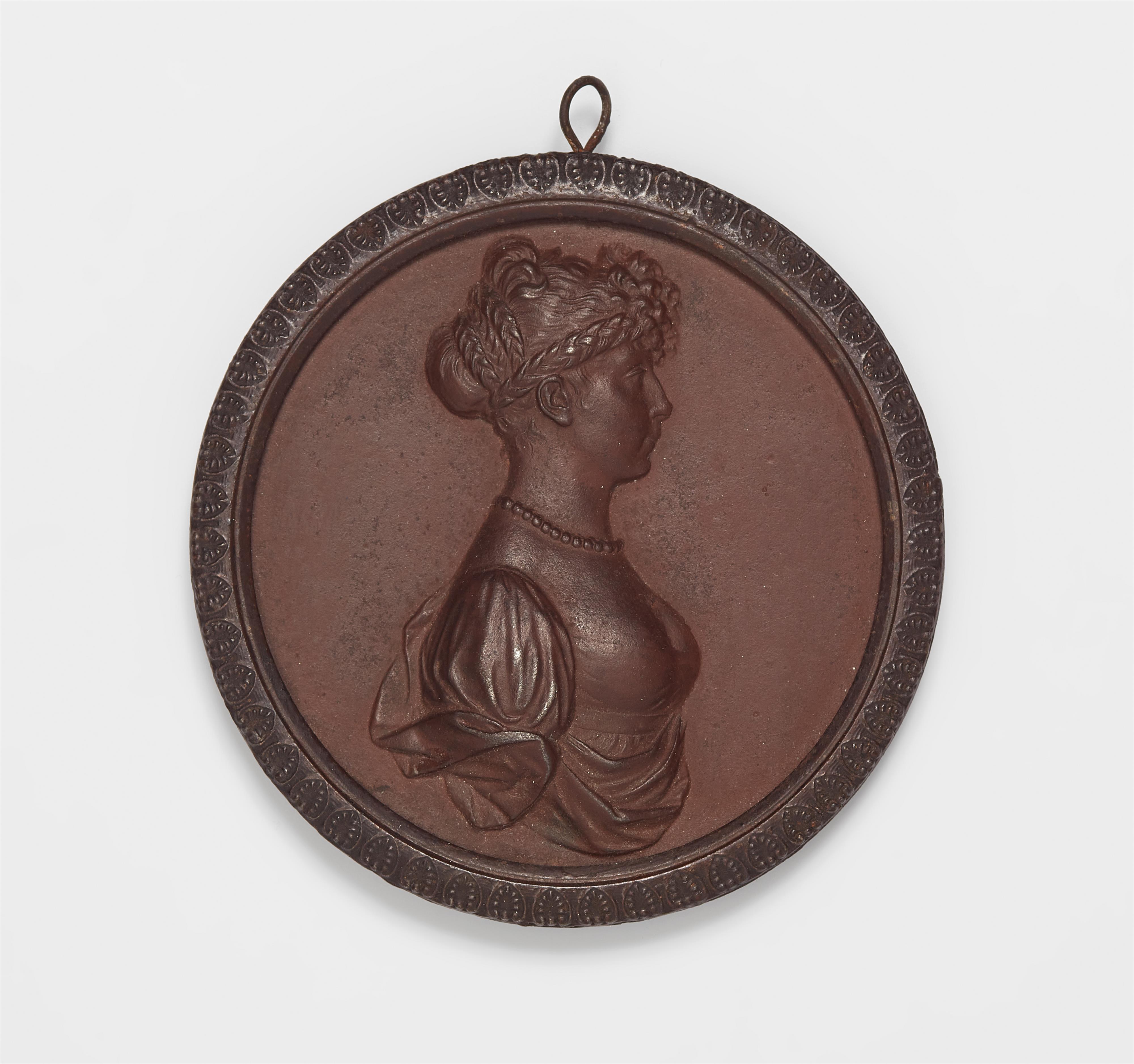 A cast iron plaque with a portrait of Queen Louise - image-1