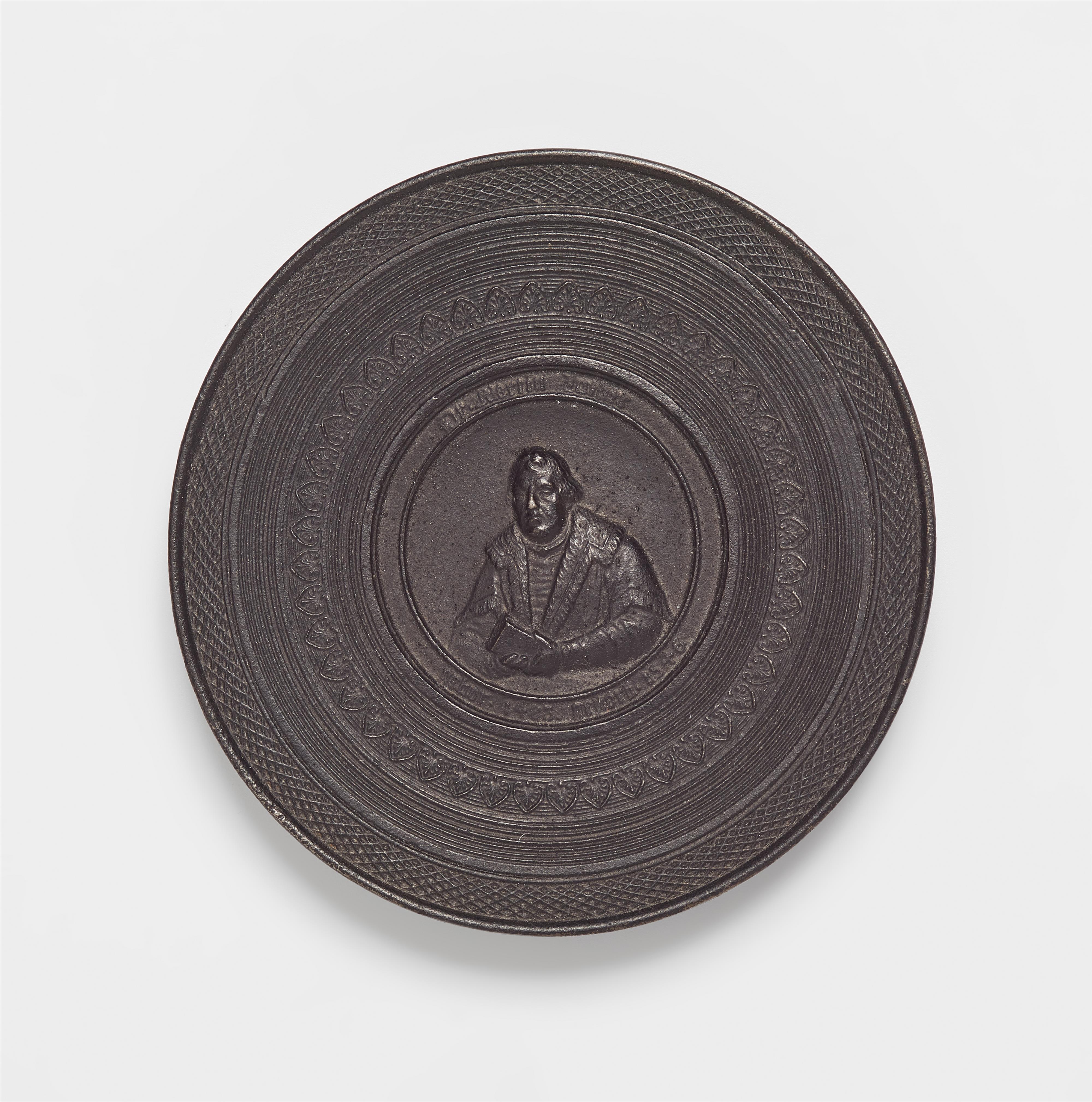 A round cast iron box with a portrait of Martin Luther - image-1