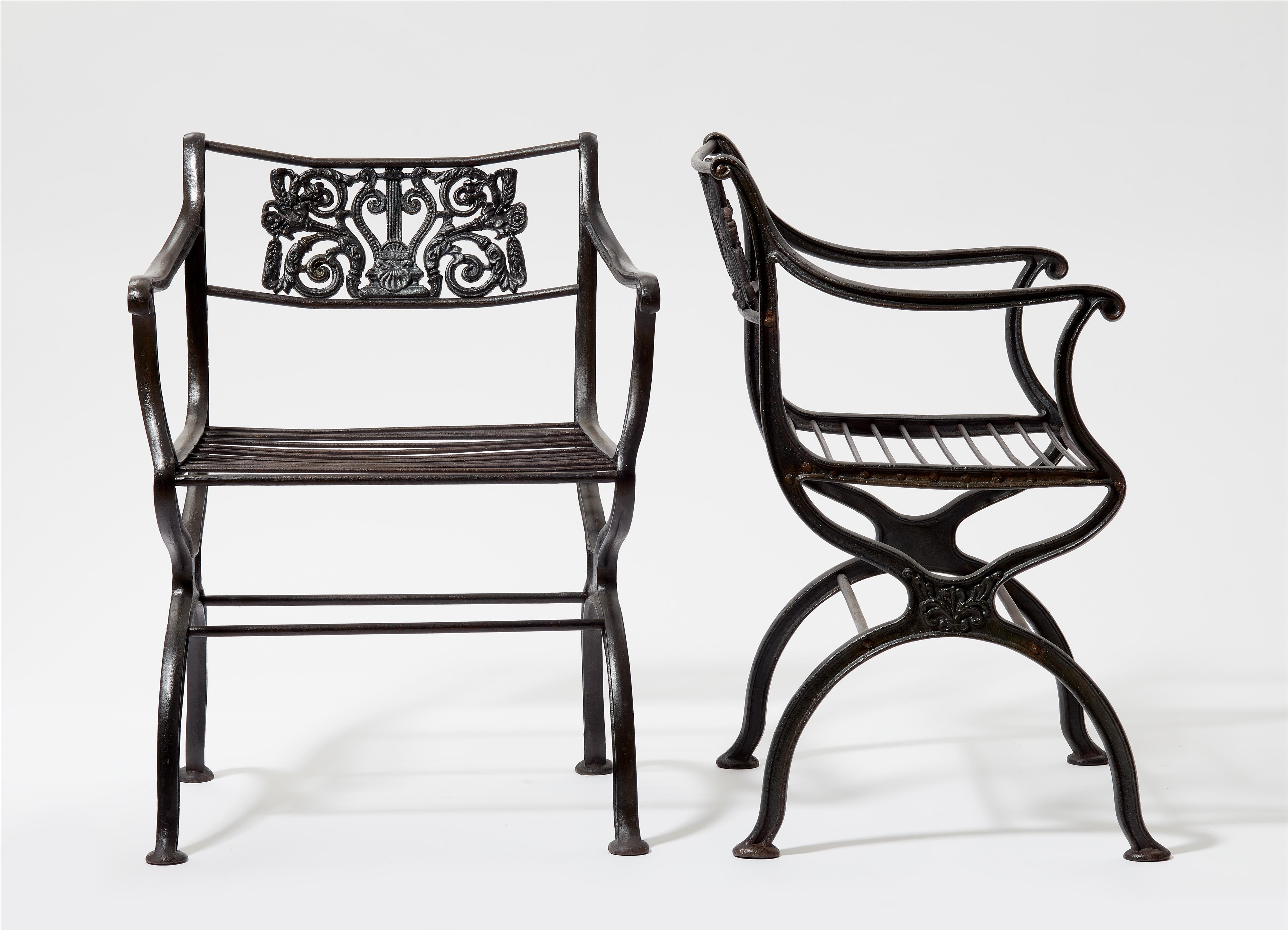 A pair of cast iron garden chairs after a design by Karl Friedrich Schinkel - image-1