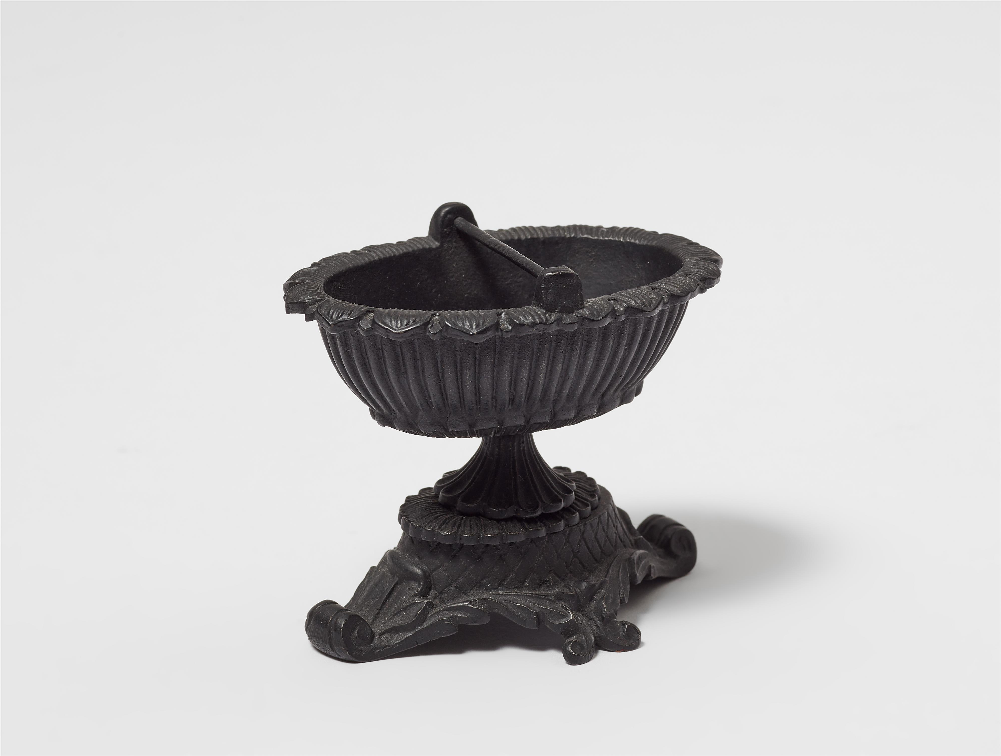 A miniature cast iron basket from a smoking set - image-1
