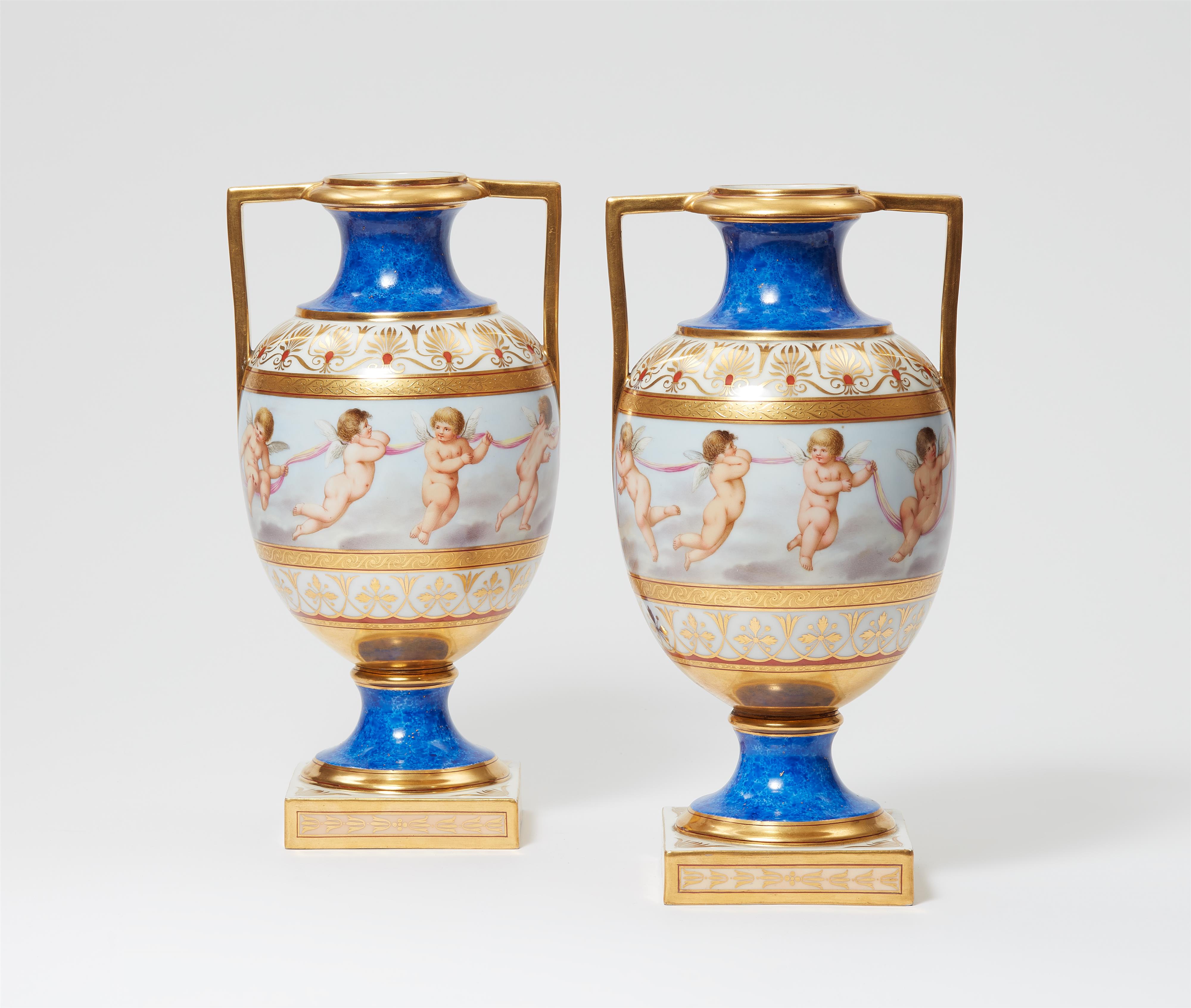 A pair of Berlin KPM porcelain vases with amoretti - image-1