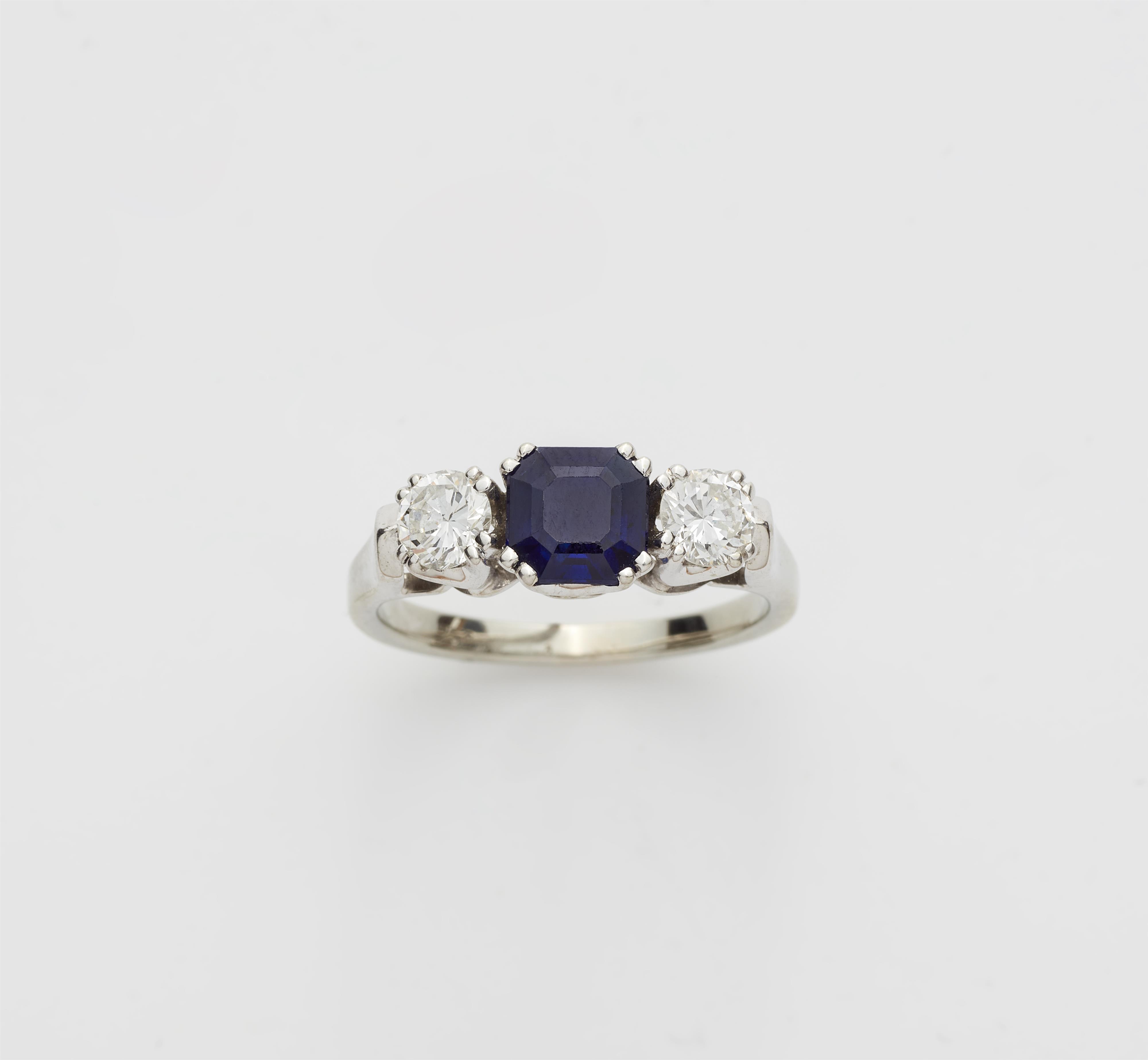 An 18k gold sapphire and diamond three stone ring. - image-1