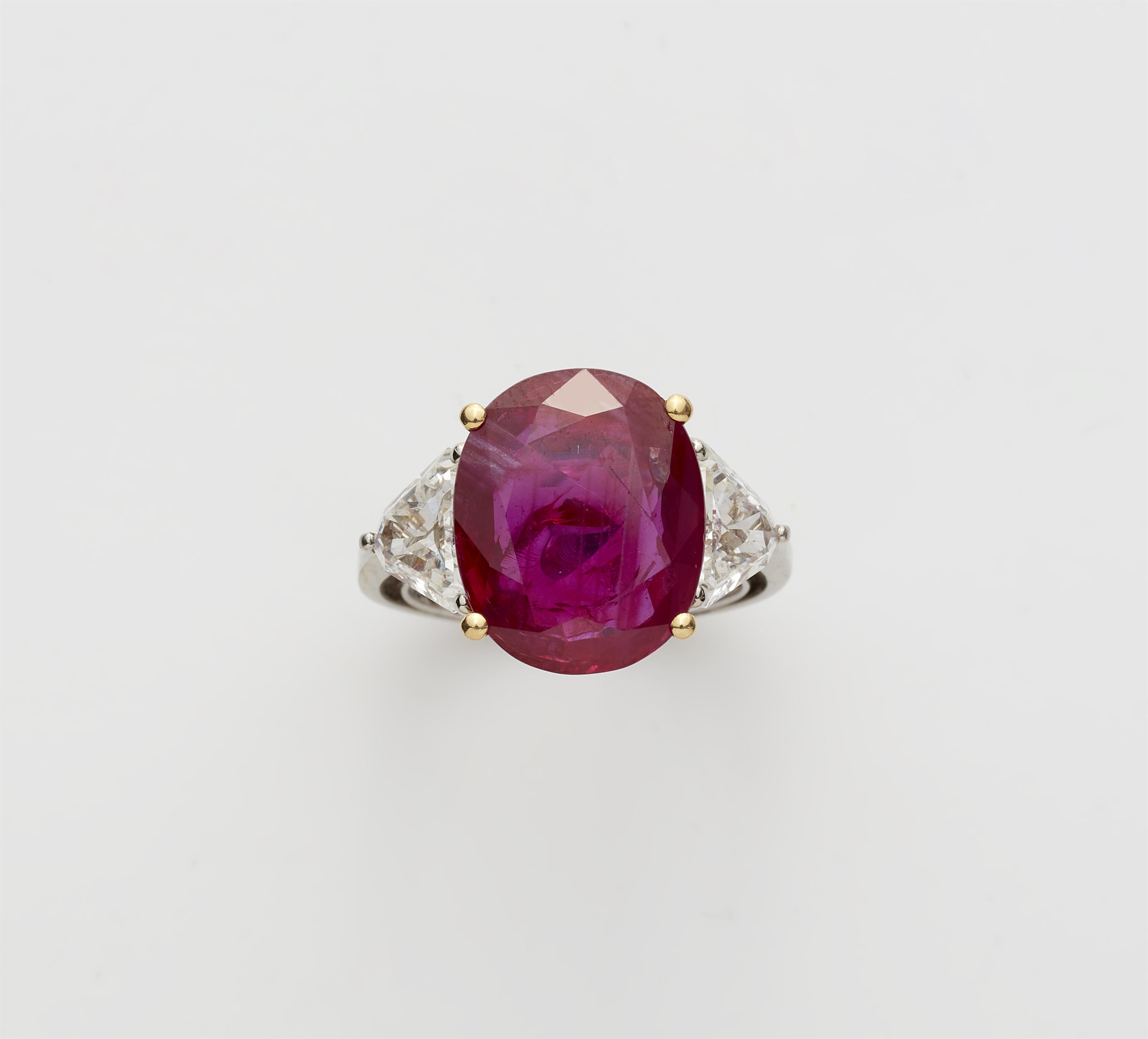 A platinum 18k gold diamond and ruby ring. - image-1