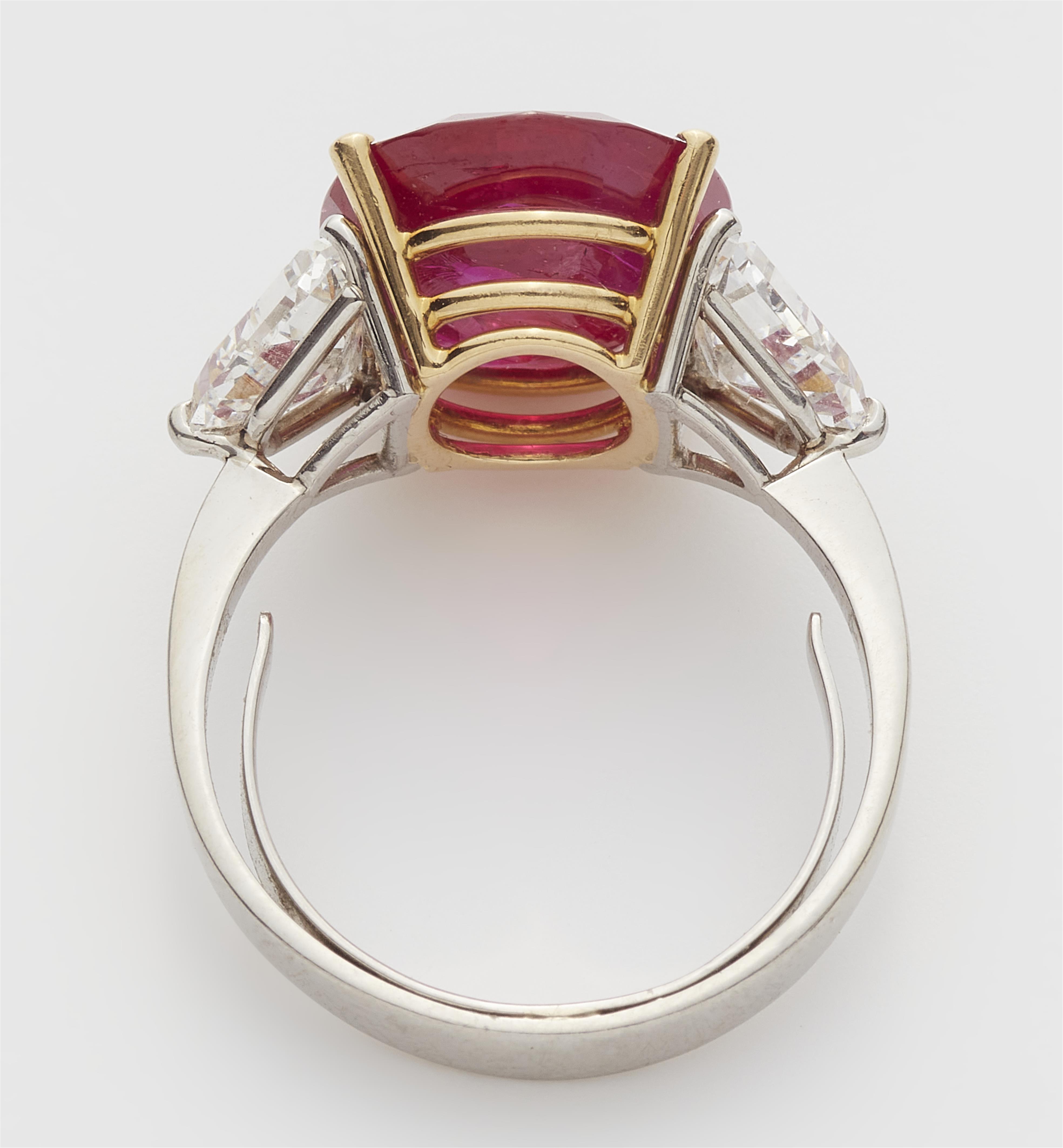A platinum 18k gold diamond and ruby ring. - image-2