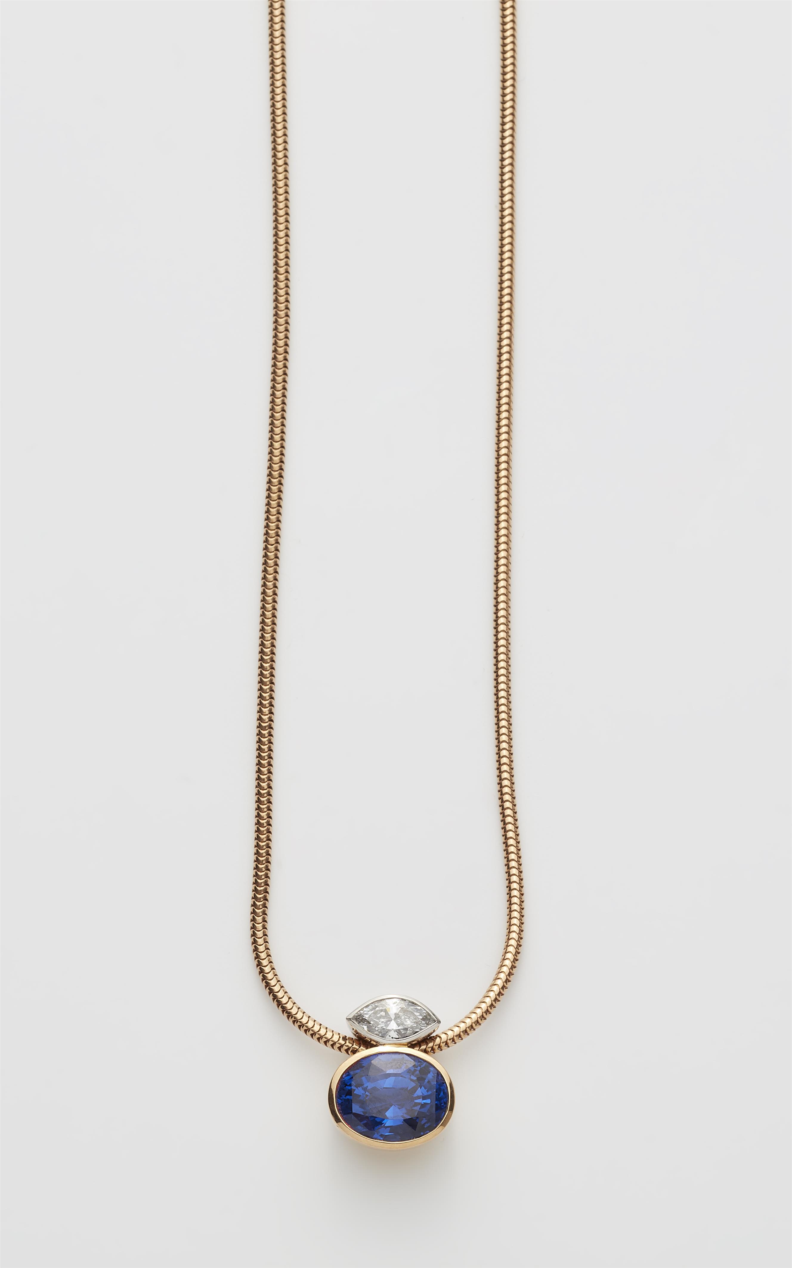 A German 18k gold navette-cut diamond and natural sapphire pendant with a rose gold necklace. - image-1