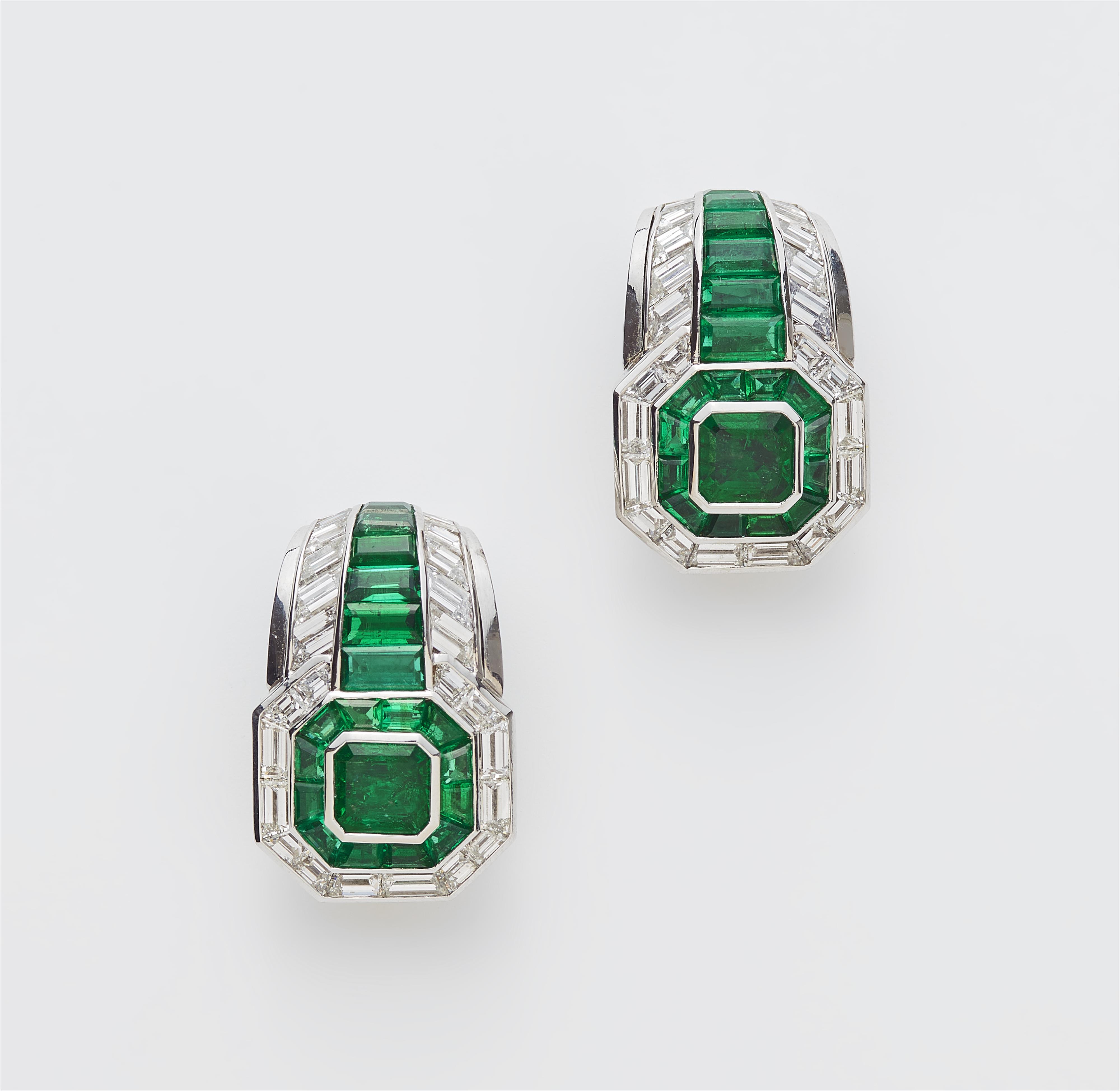 A pair of 18k white gold emerald and diamond cocktail clip earrings. - image-1