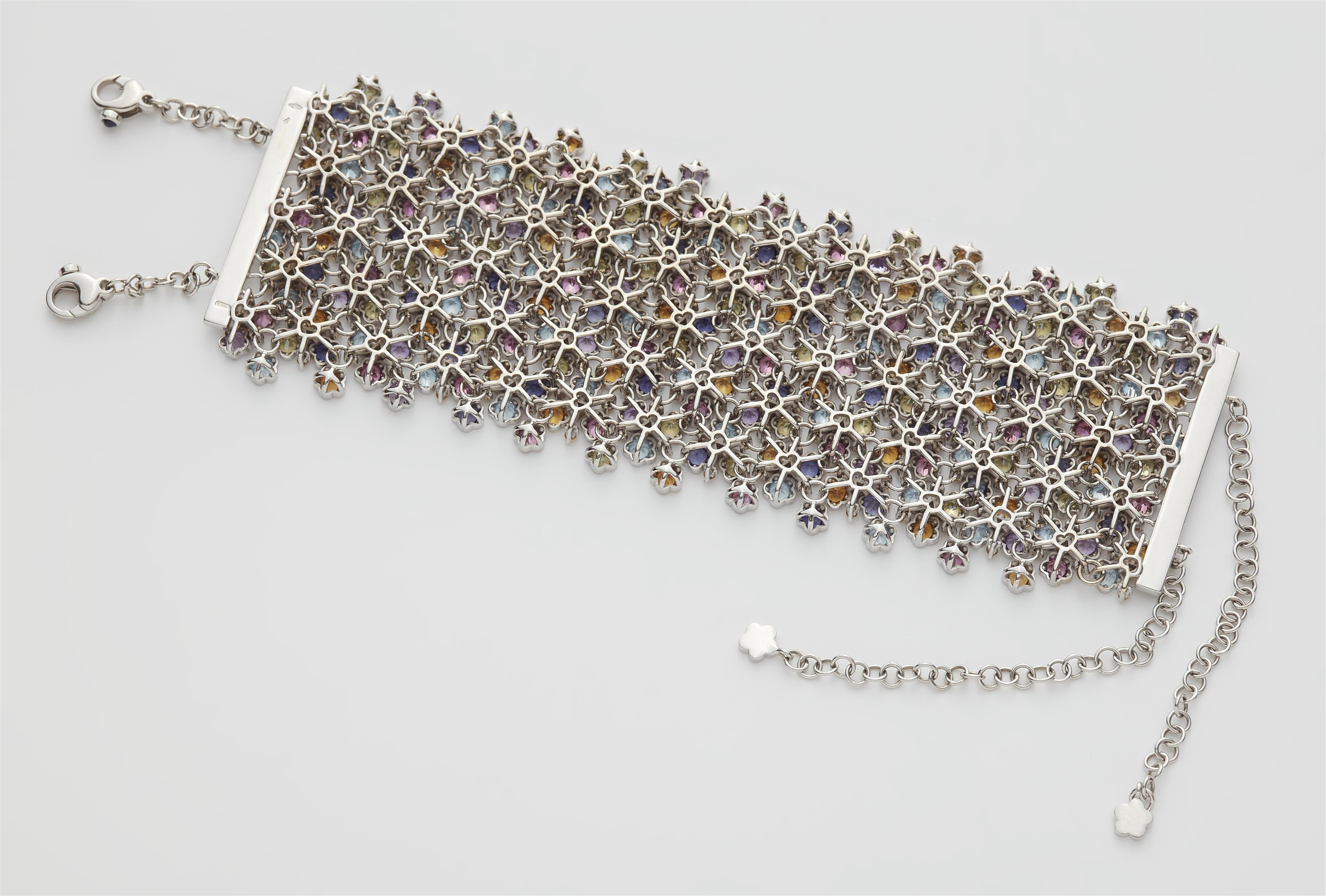 An Italian 18k white gold and coloured gemstone smooth meshwork cuff bracelet. - image-2