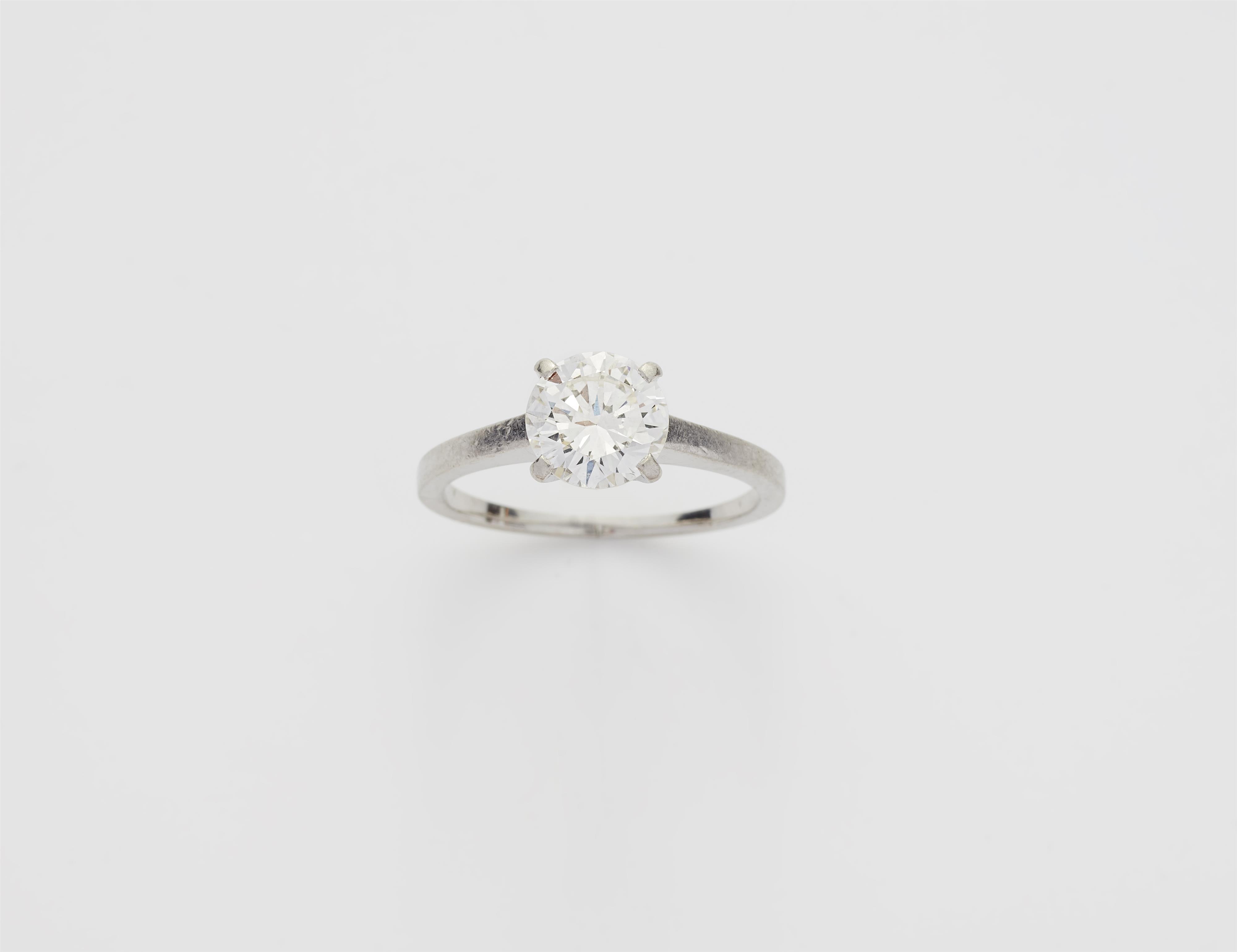 A platinum and c. 1.69 ct brilliant-cut diamond solitaire ring. - image-1