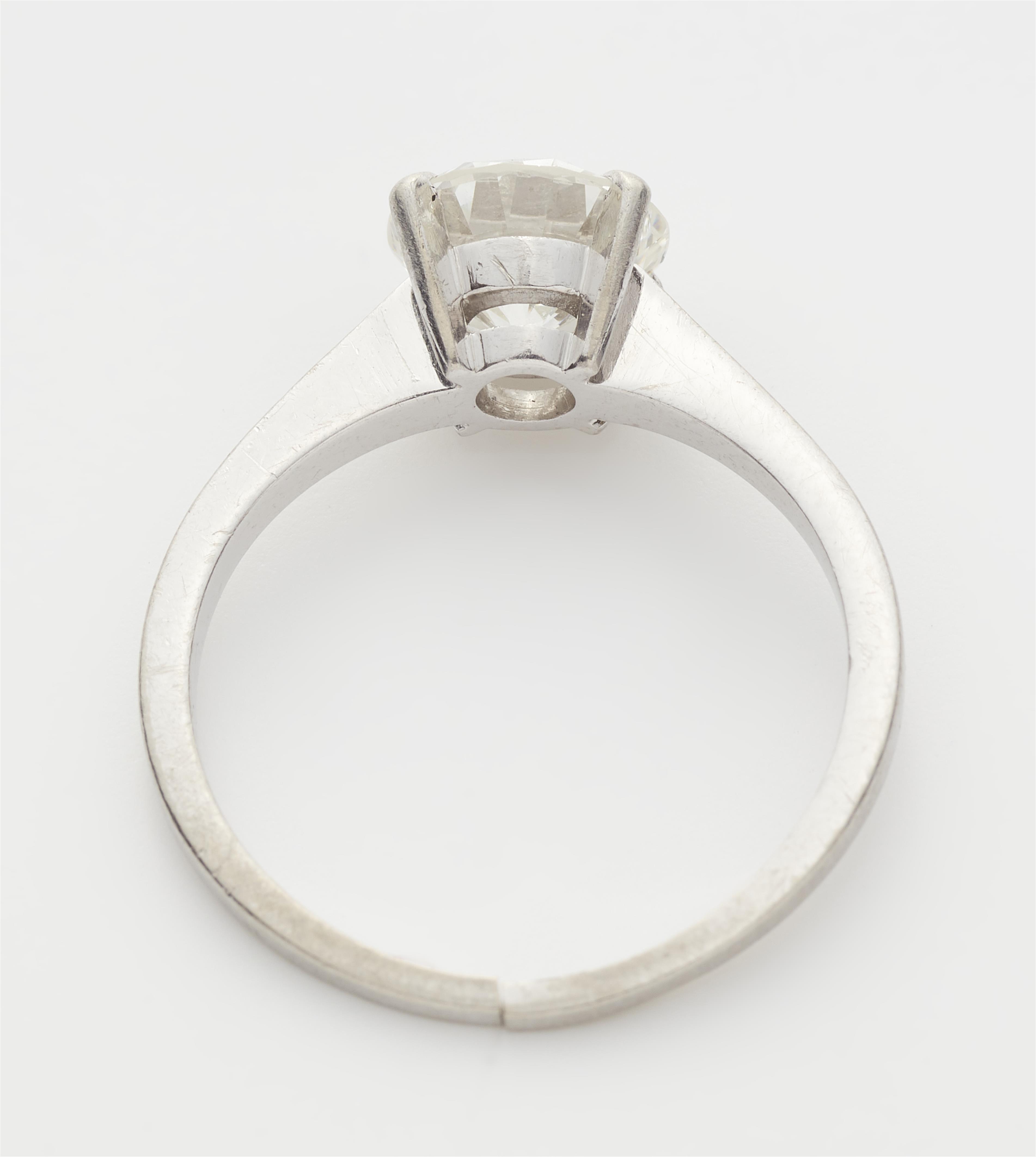 A platinum and c. 1.69 ct brilliant-cut diamond solitaire ring. - image-2