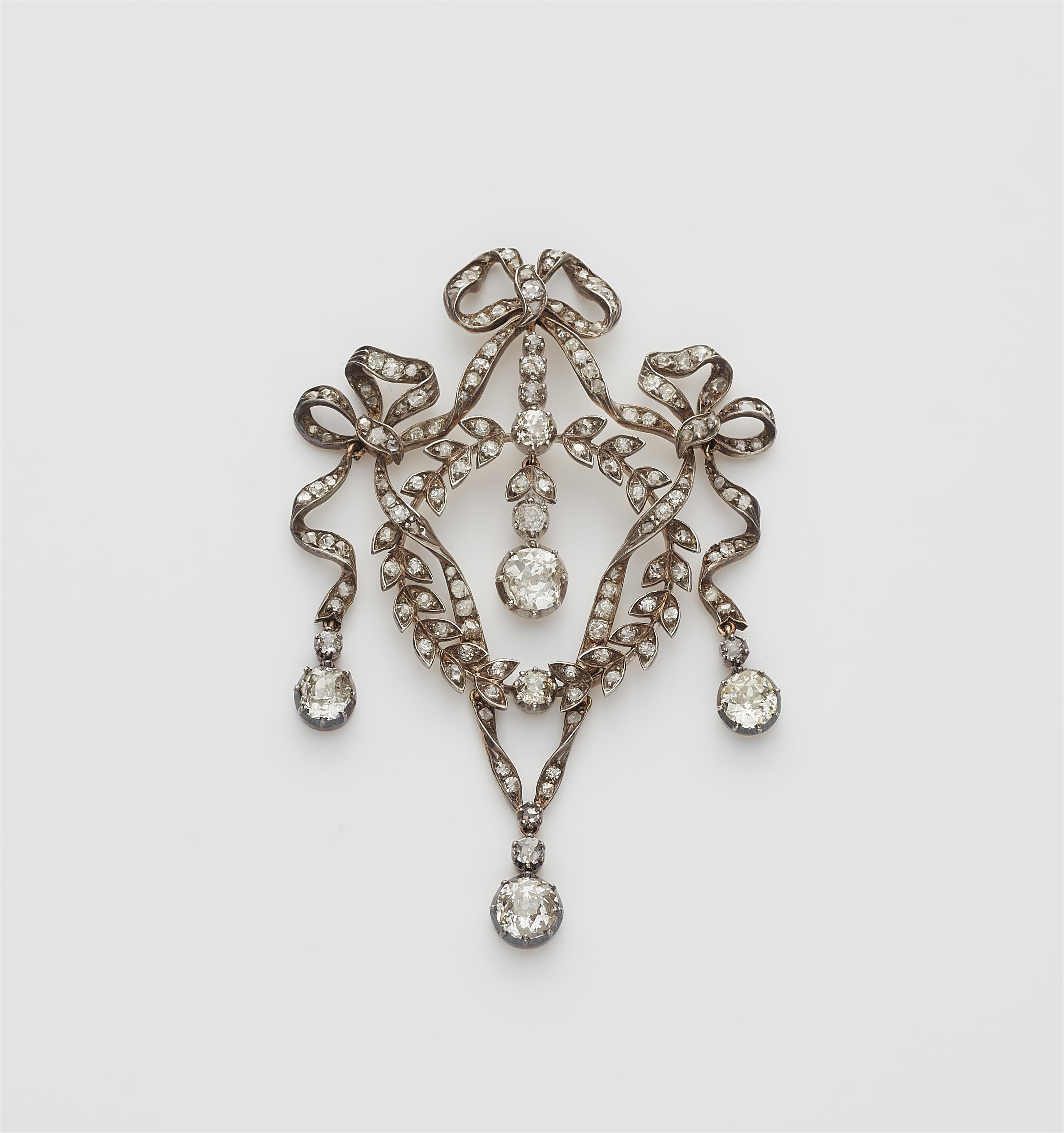 An Edwardian silver 14k gold and diamond garland pendant with original case. Mountings lost. - image-1