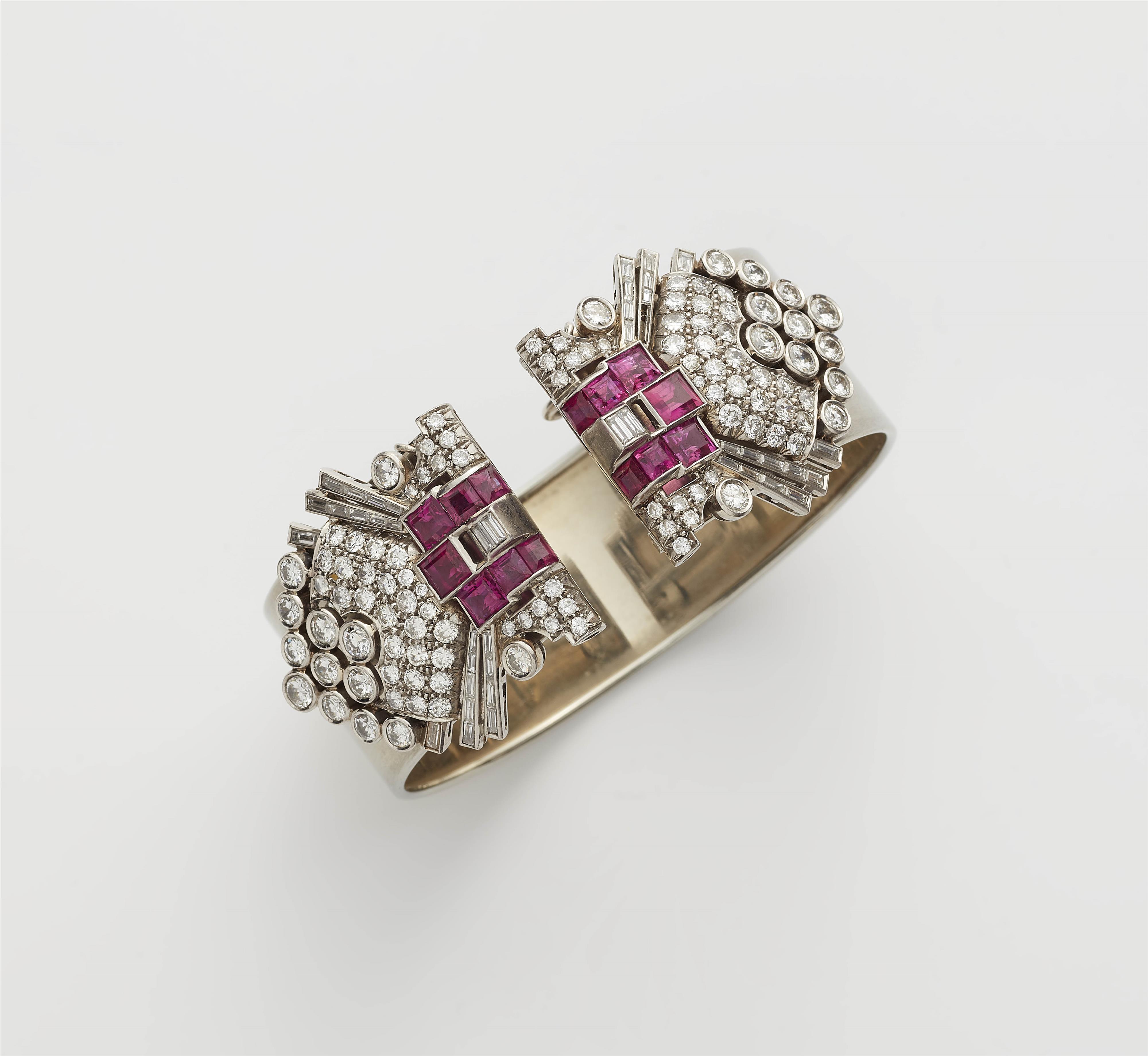 A pair of platinum diamond and ruby Art Déco clips alternatively to be worn on an attached stainless steel bangle. - image-1
