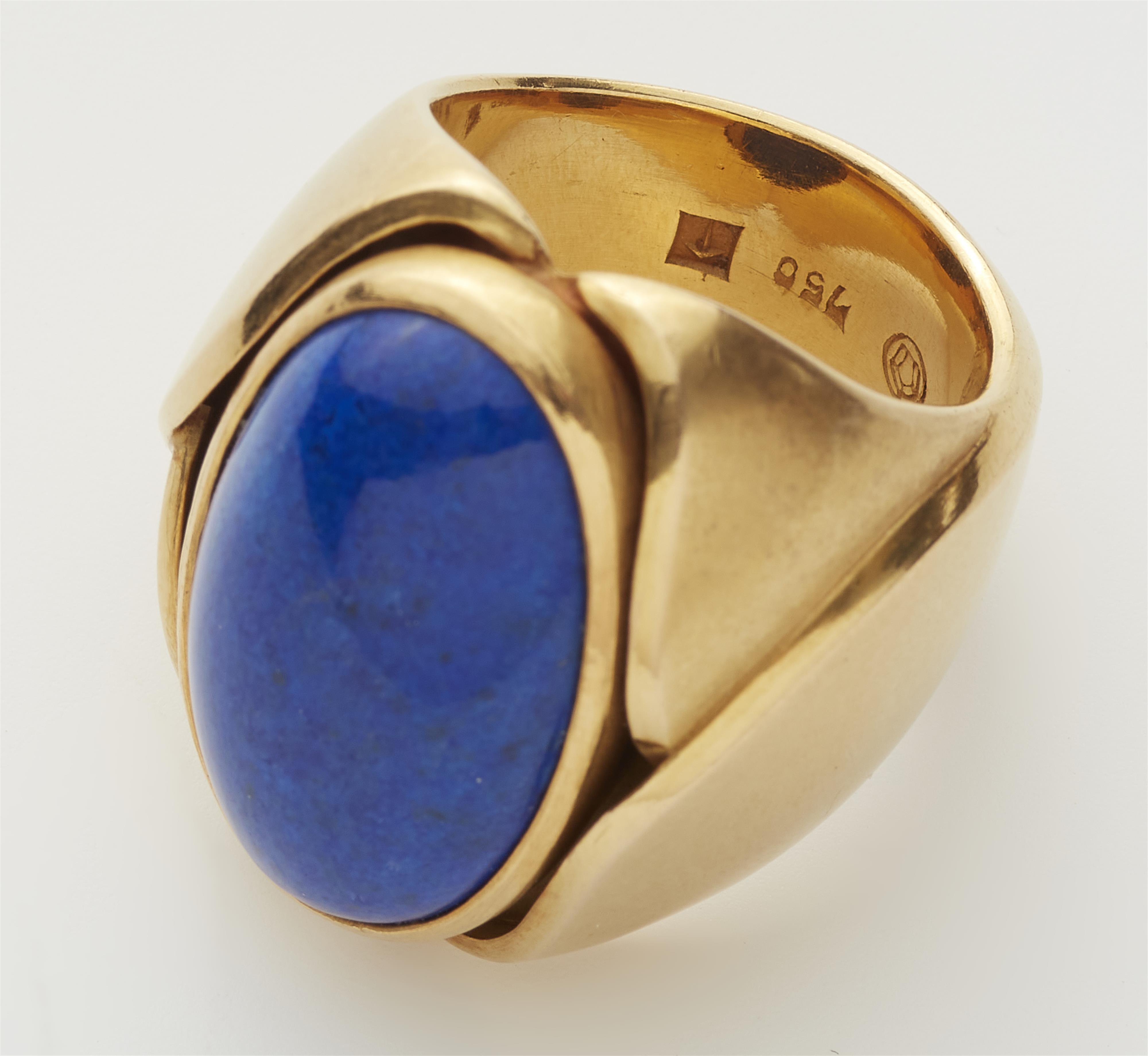 A solid forged 18k gold and lapis lazuli cabochon ring. - image-2