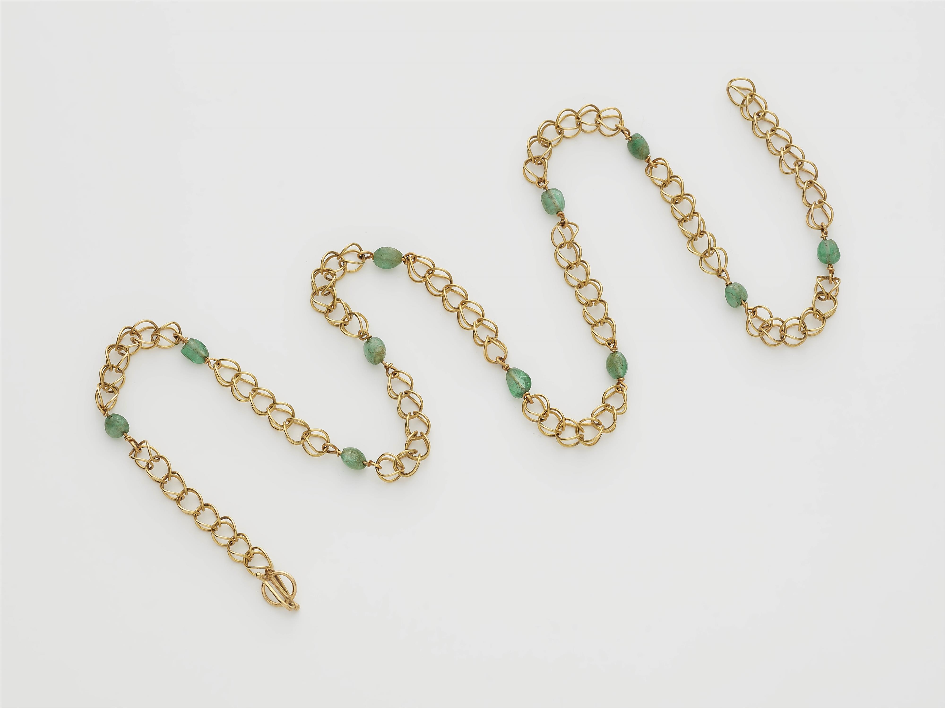 A German 18k gold wire and emerald necklace. - image-1