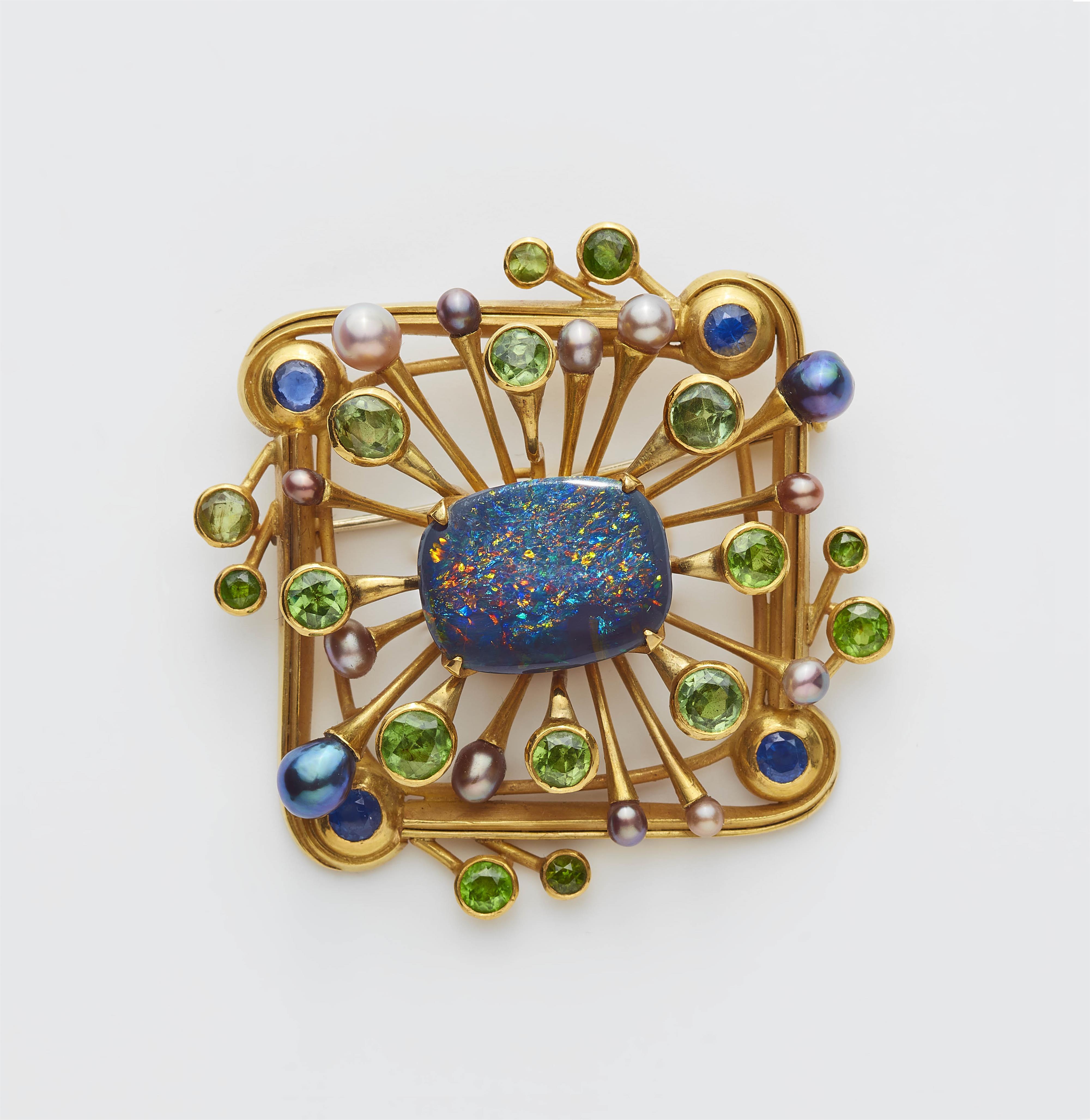 A German 18k gold, black opal, demantoid, blue sapphire and pearl brooch. - image-1
