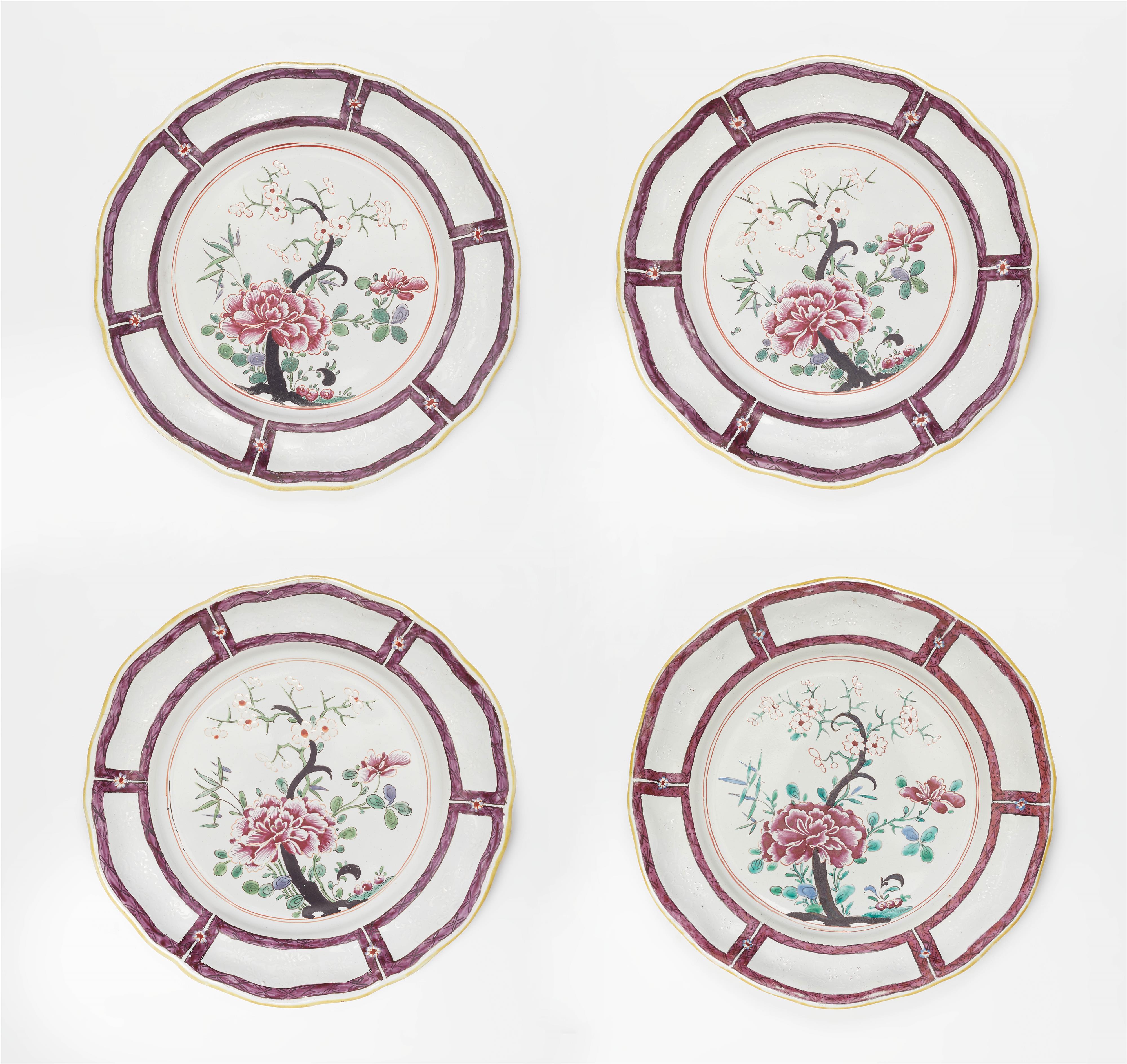 Four Holíč faience plates with famille rose decor - image-1
