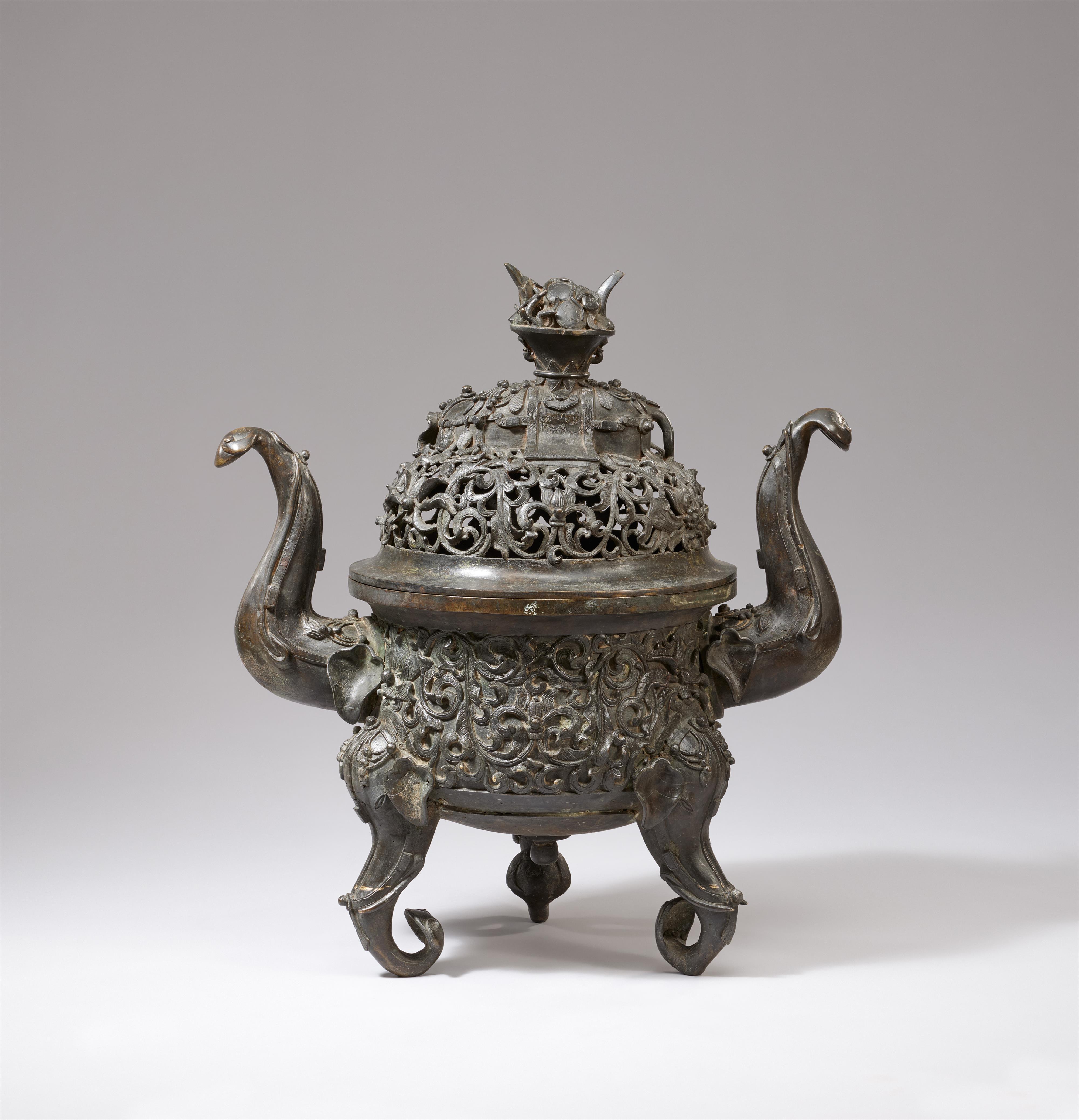 A large elephant tripod bronze incense burner and cover.
18th century or later - image-2