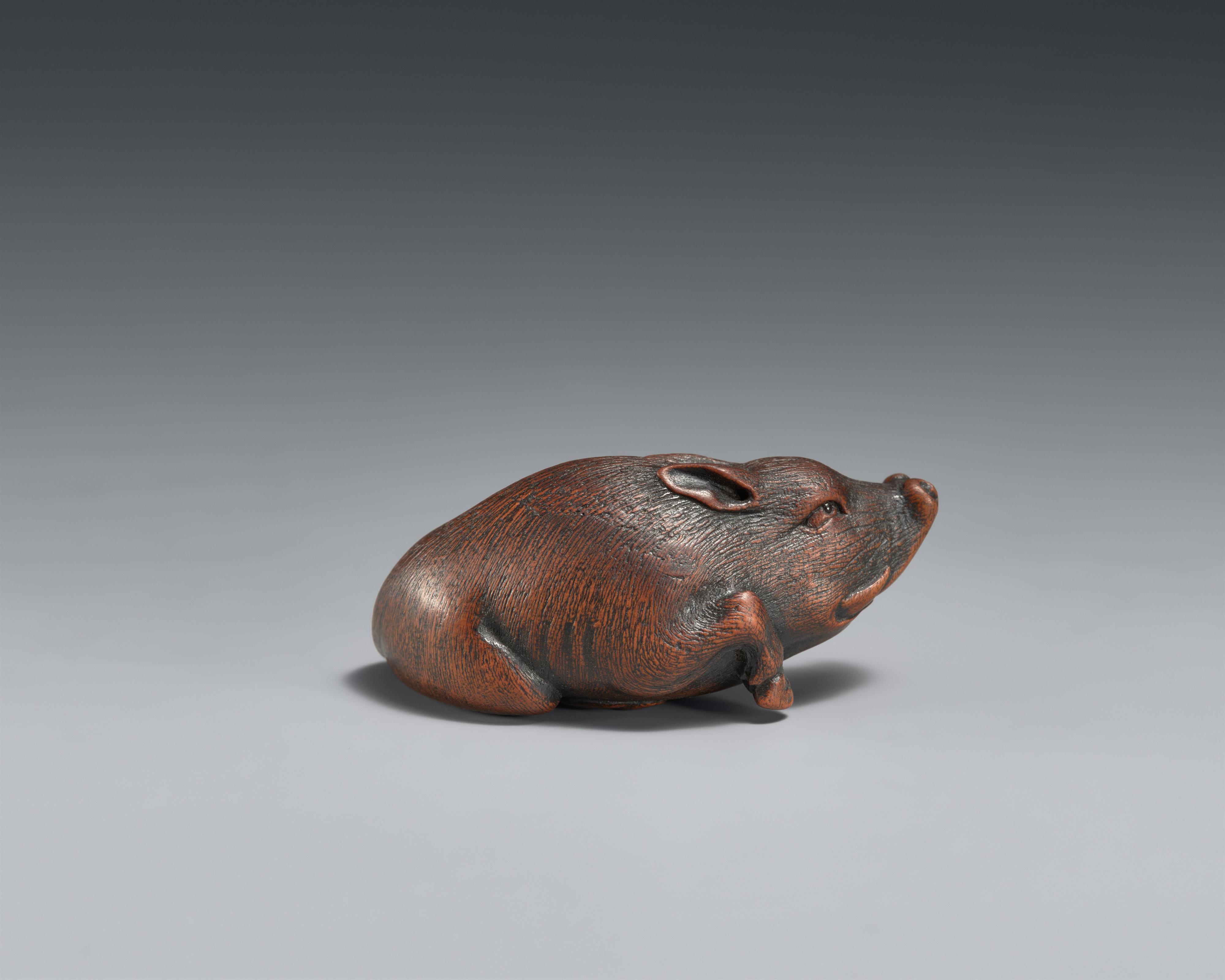 A small boxwood netsuke of a recumbent boar. Nagoya. Mid-19th century - image-2