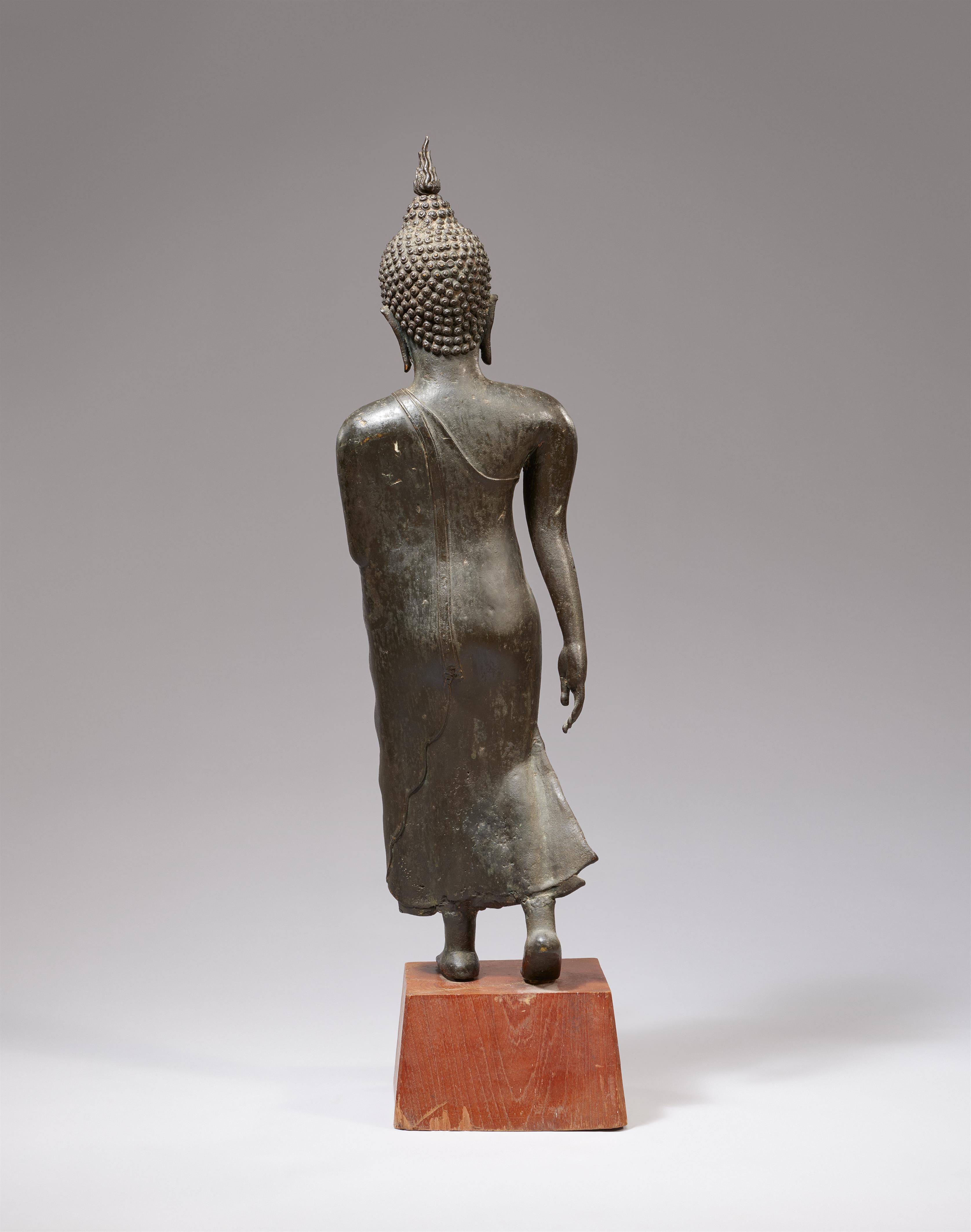 A Sukhothai-style bronze figure of a walking Buddha. Thailand. 14th century or later - image-2