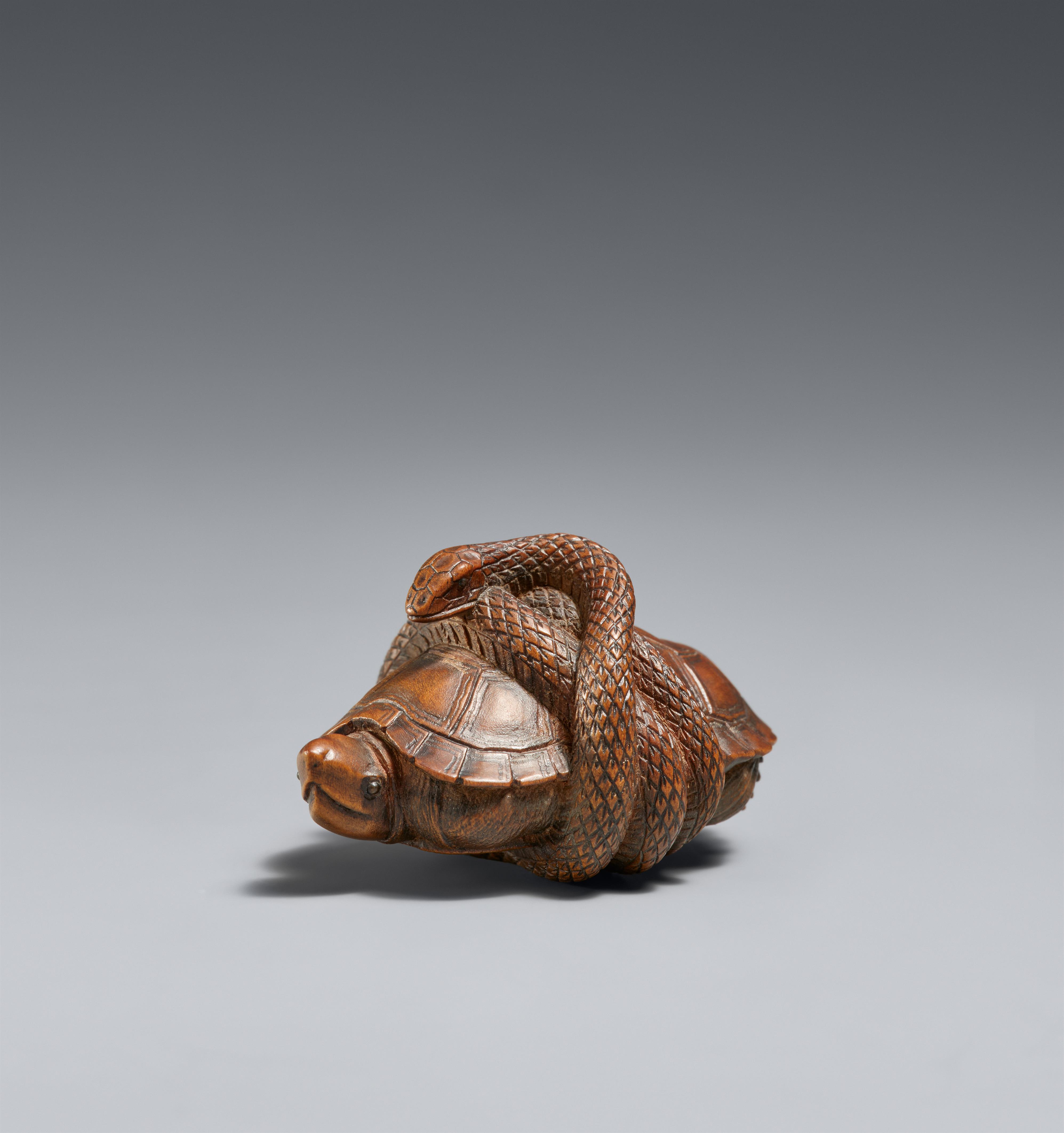 A wood netsuke of a tortoise and snake. 19th century - image-1