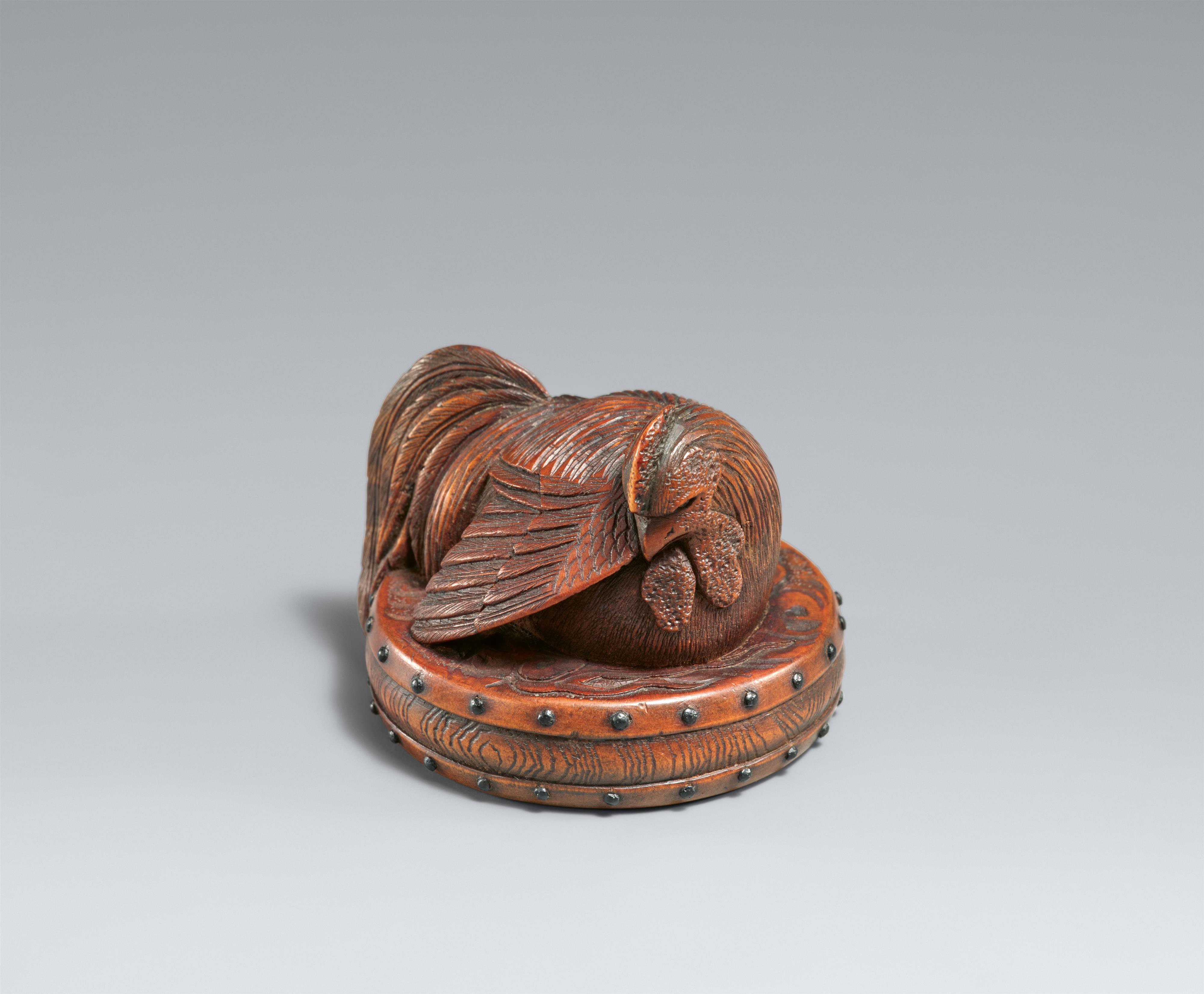 A boxwood netsuke of a large rooster on a flat drum. Second half 19th century - image-1