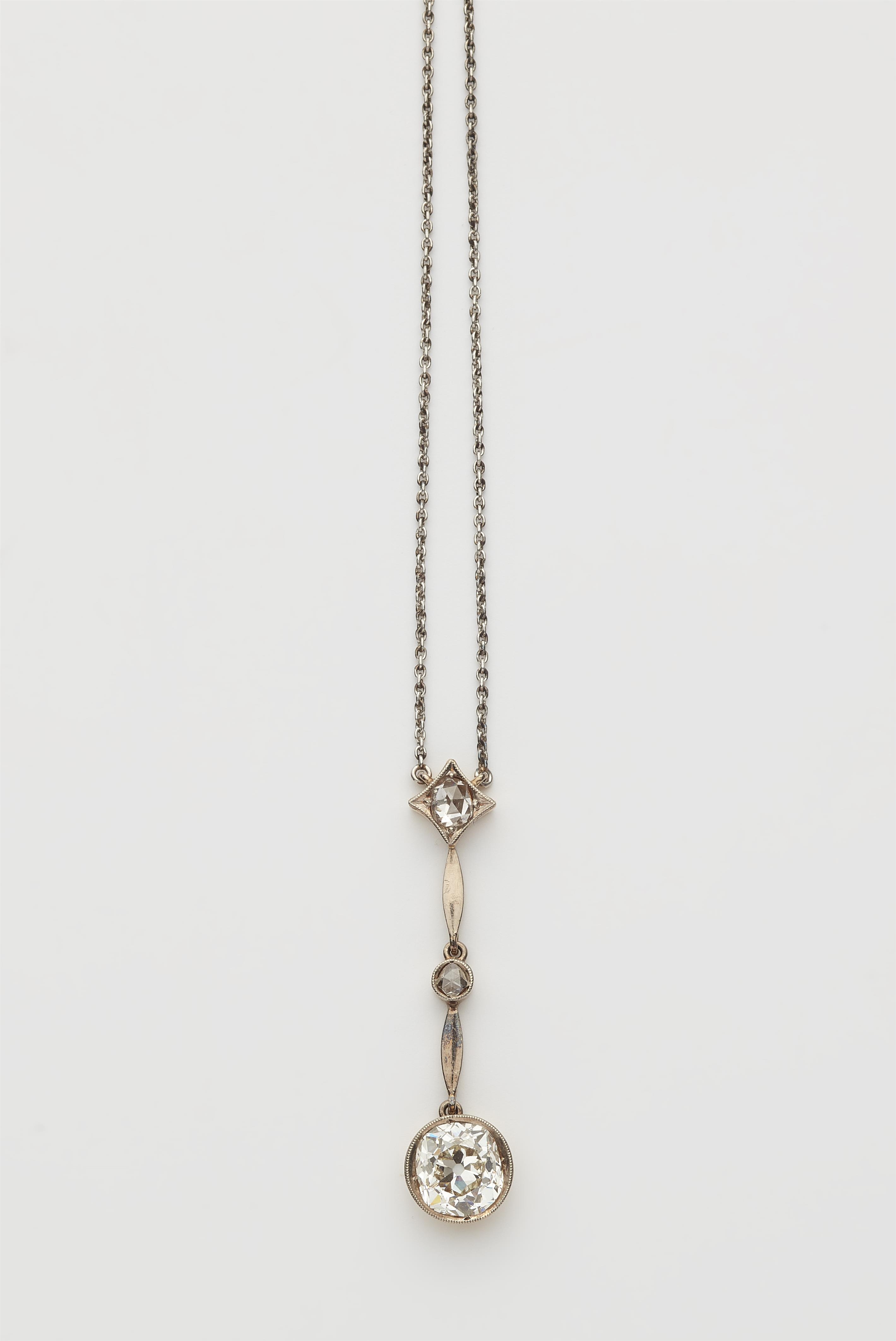 A Belle Epoque 14 kt gold platinum and European old-cut diamond solitaire pendant necklace. - image-1