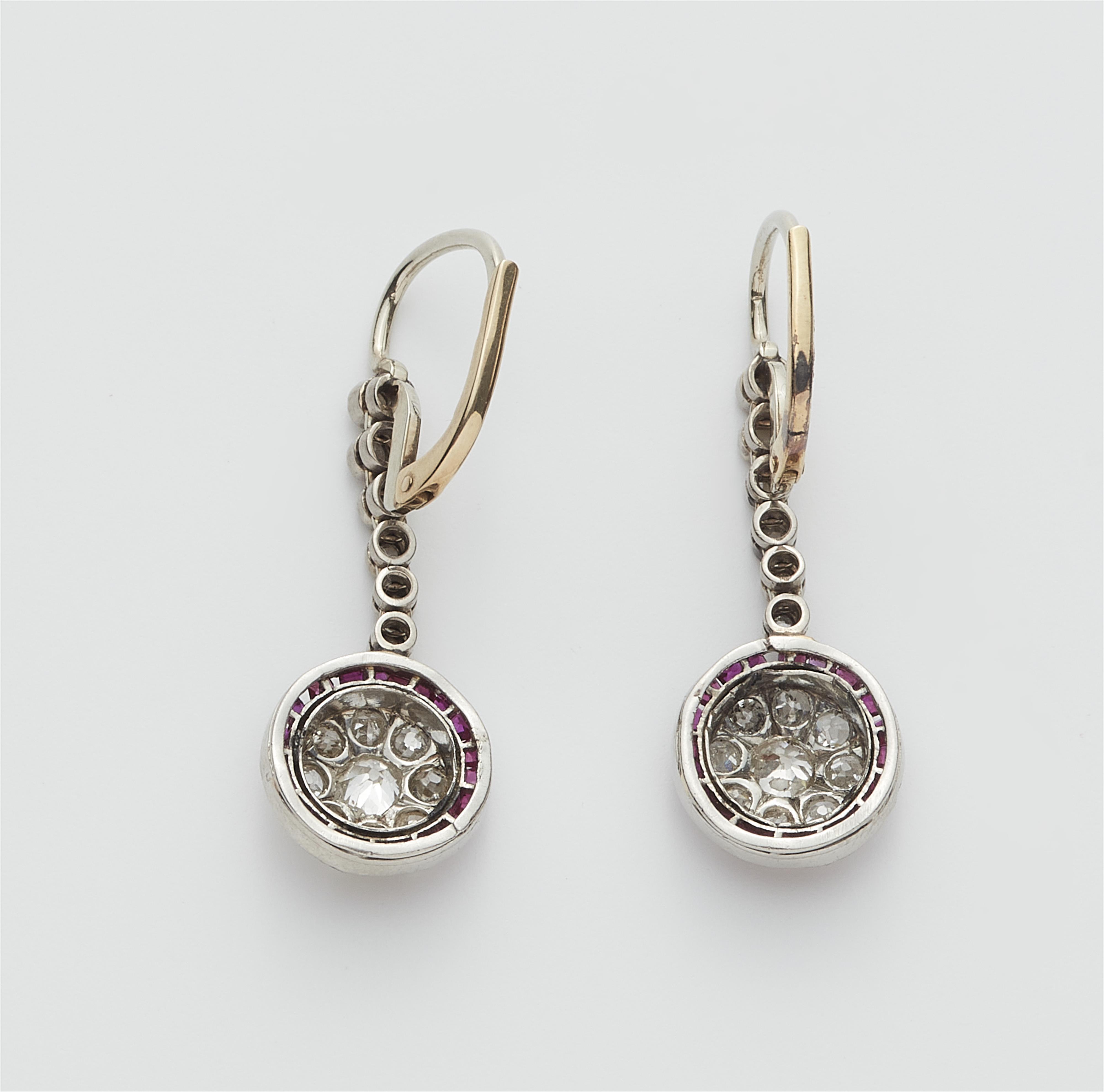 A pair of platinum 14k gold diamond and ruby Belle Epoque earrings. - image-2