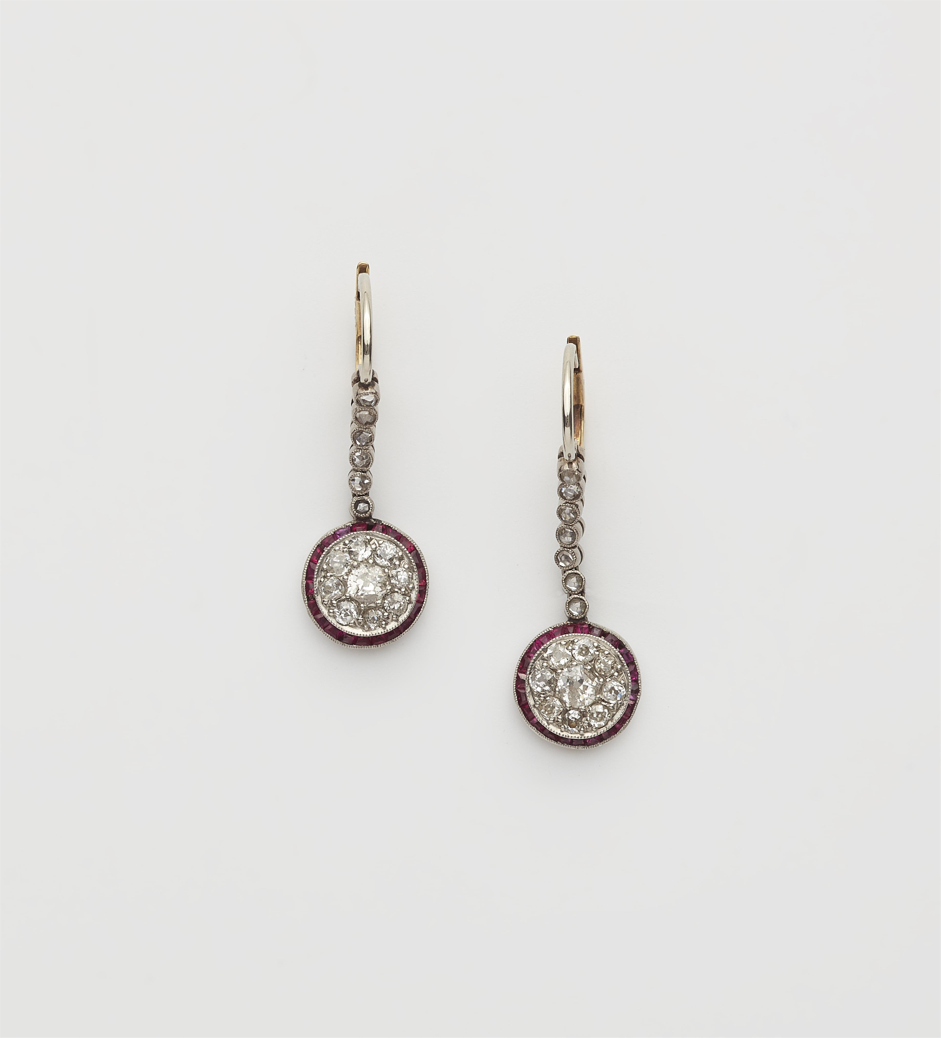 A pair of platinum 14k gold diamond and ruby Belle Epoque earrings. - image-1